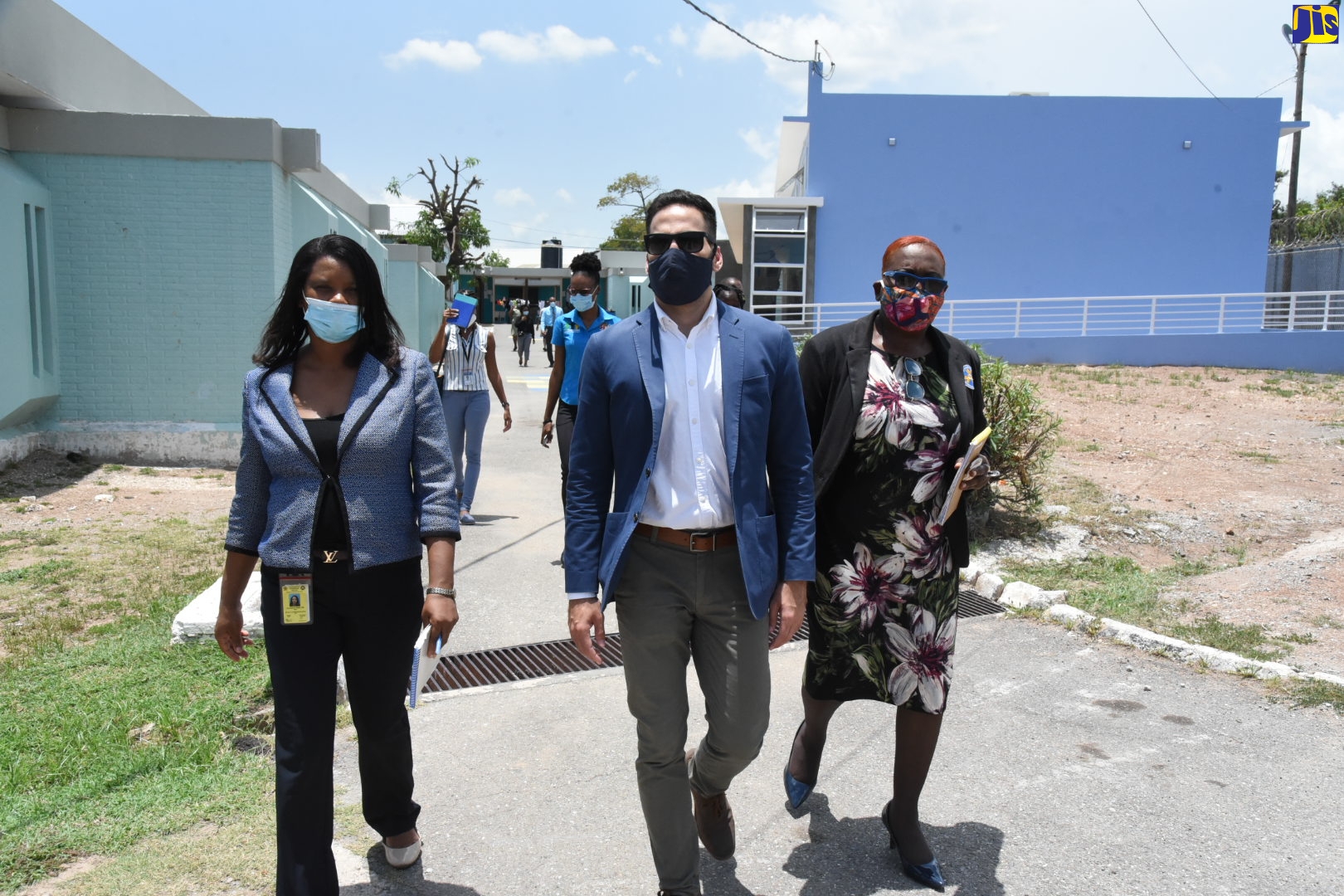 Director of Juvenile Services at South Camp Juvenile Remand and Correctional Centre, Claudette Hamilton (left); Technical Advisor to the Minister of National Security, Alexander Causwell (centre) and Superintendent in Charge of South Camp Juvenile Remand and Correctional Centre, Maulette White, on their way to tour the new multipurpose classroom established at the South Camp Juvenile Remand and Correctional Centre, Kingston, on Wednesday (July 29).