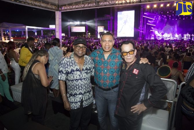 Prime Minister, the Most Hon. Andrew Holness (centre), shares a moment with Minister of Tourism, Hon. Edmund Bartlett (left); and Chief Executive Officer (CEO) of Downsound Records, producers of Reggae Sumfest, Joe Bogdanovich, at last year’s event in Catherine Hall, Montego Bay in 2019. (FILE - Garwin Davis Photo)