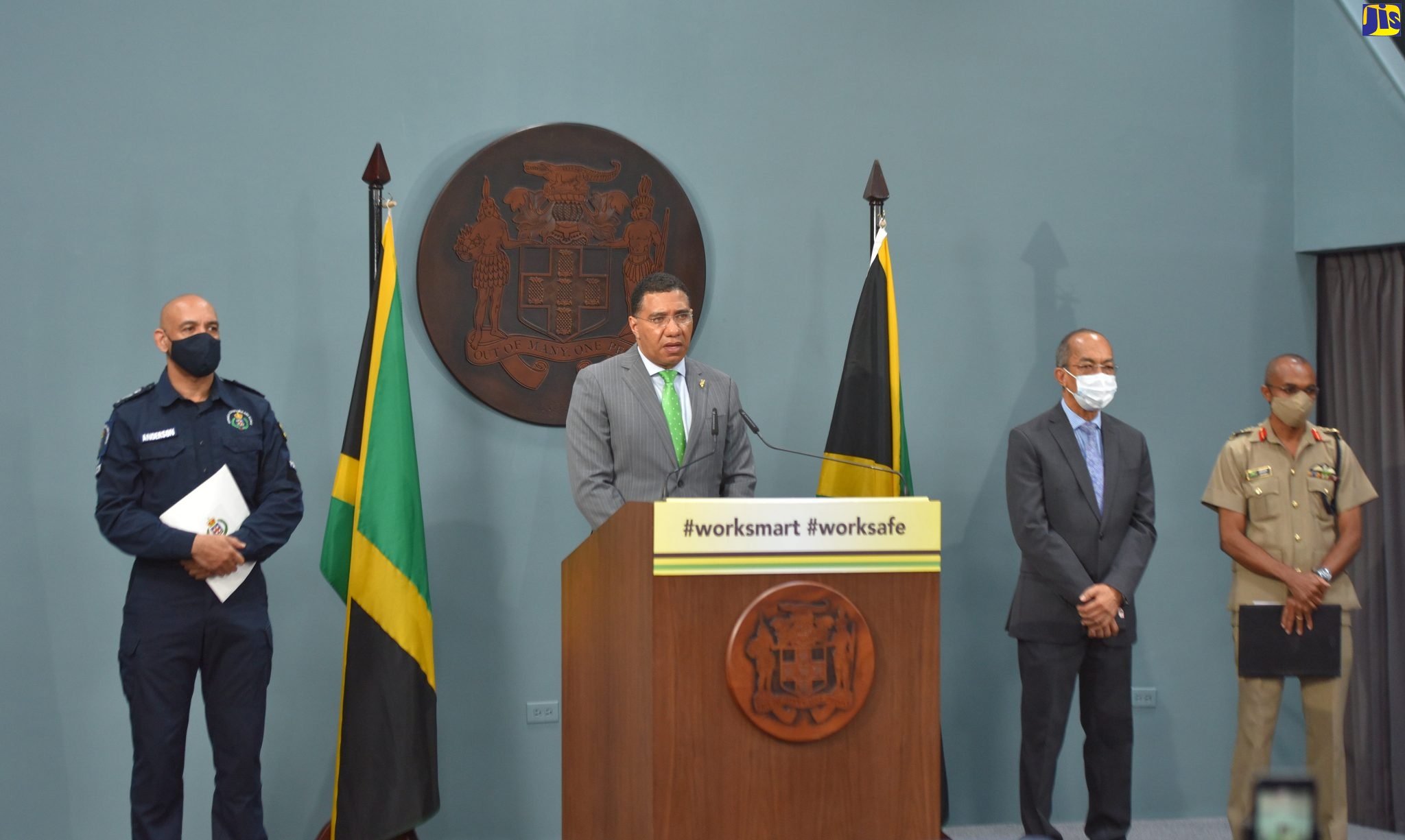 Prime Minister, the Most Hon. Andrew Holness (second left), addresses  a virtual press briefing at the Office of the Prime Minister Media Centre  in Kingston, on Wednesday (July 8).
With the Prime Minister (from left) are Commissioner of Police, Major General Antony Anderson; Minister of National Security , Hon. Dr. Horace Chang; and Chief of Defence Staff, Lieutenant General Rocky Meade.
