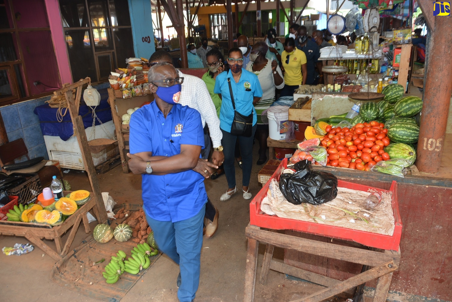 Minister of Local Government and Community Development, Hon. Desmond McKenzie, tours the Brown’s Town Market in St. Ann on Tuesday (August 4).