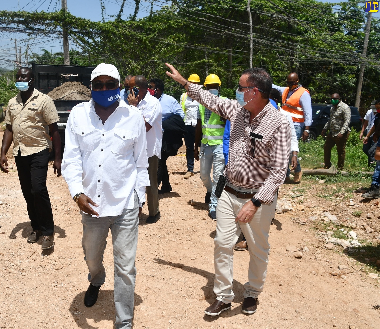 Minister of Tourism, Hon. Edmund Bartlett (left); and Minister without Portfolio in the Ministry of Economic Growth and Job Creation, Hon. Daryl Vaz, tour a section of Grange Pen in St. James, recently.
