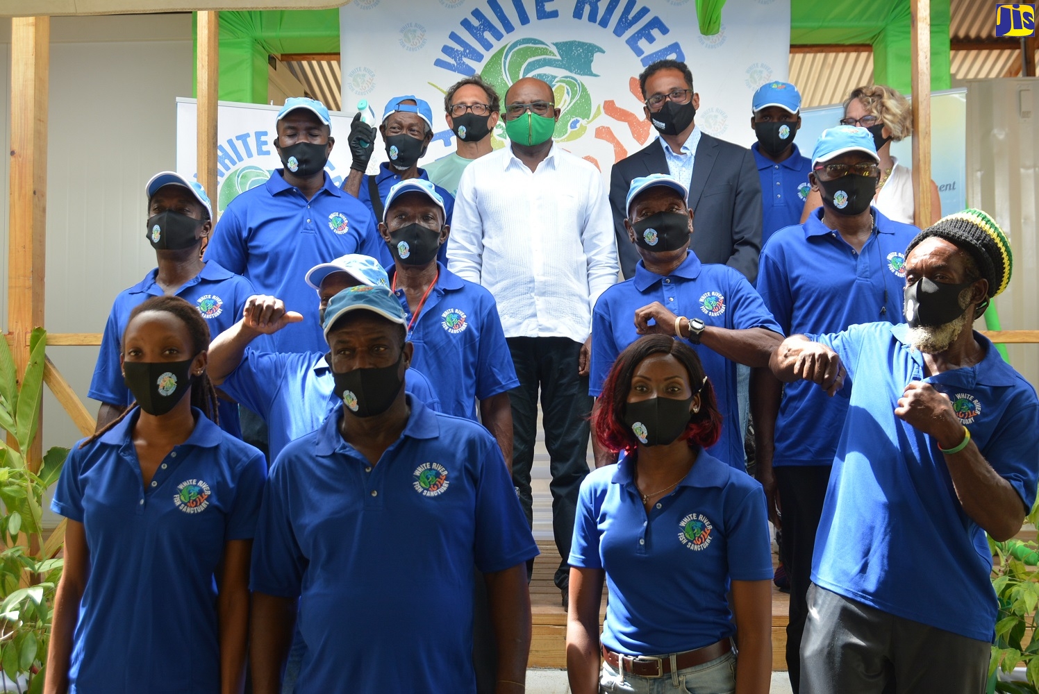 Minister of Tourism, Hon. Edmund Bartlett (centre); and Executive Director of the Tourism Enhancement Fund (TEF), Dr. Carey Wallace (to the Minister’s left), with the White River Fish Sanctuary Wardens following the launch of the entity’s new base of operation, located on the Old White River Road in St. Ann, on Thursday, August 13.