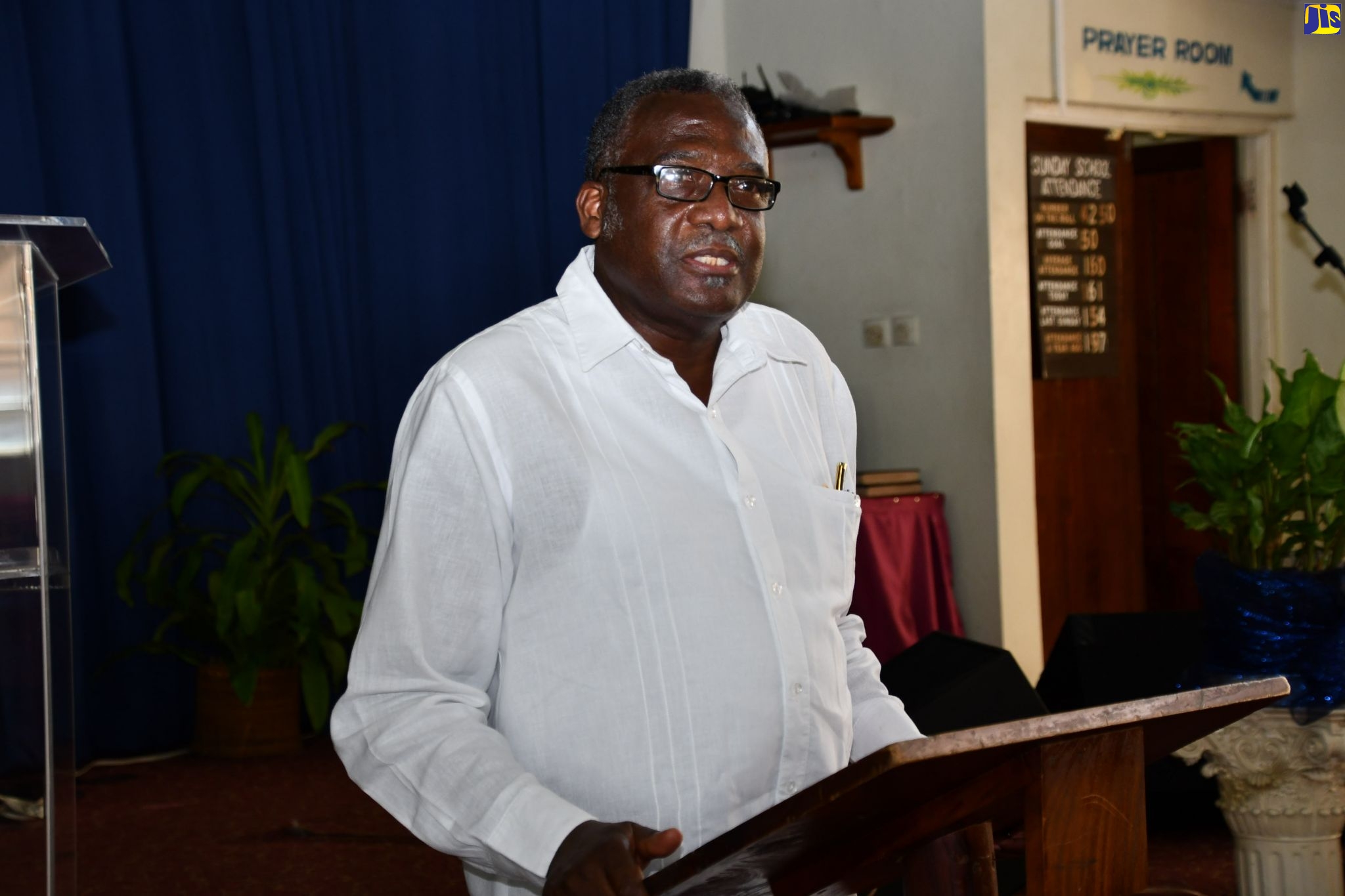 Custos Rotulorum for St. James, Bishop the Hon. Conrad Pitkin, addressing attendees during his annual back-to-school treat, which was held at the Faith Temple Assemblies of God Church in Montego Bay on August 21.