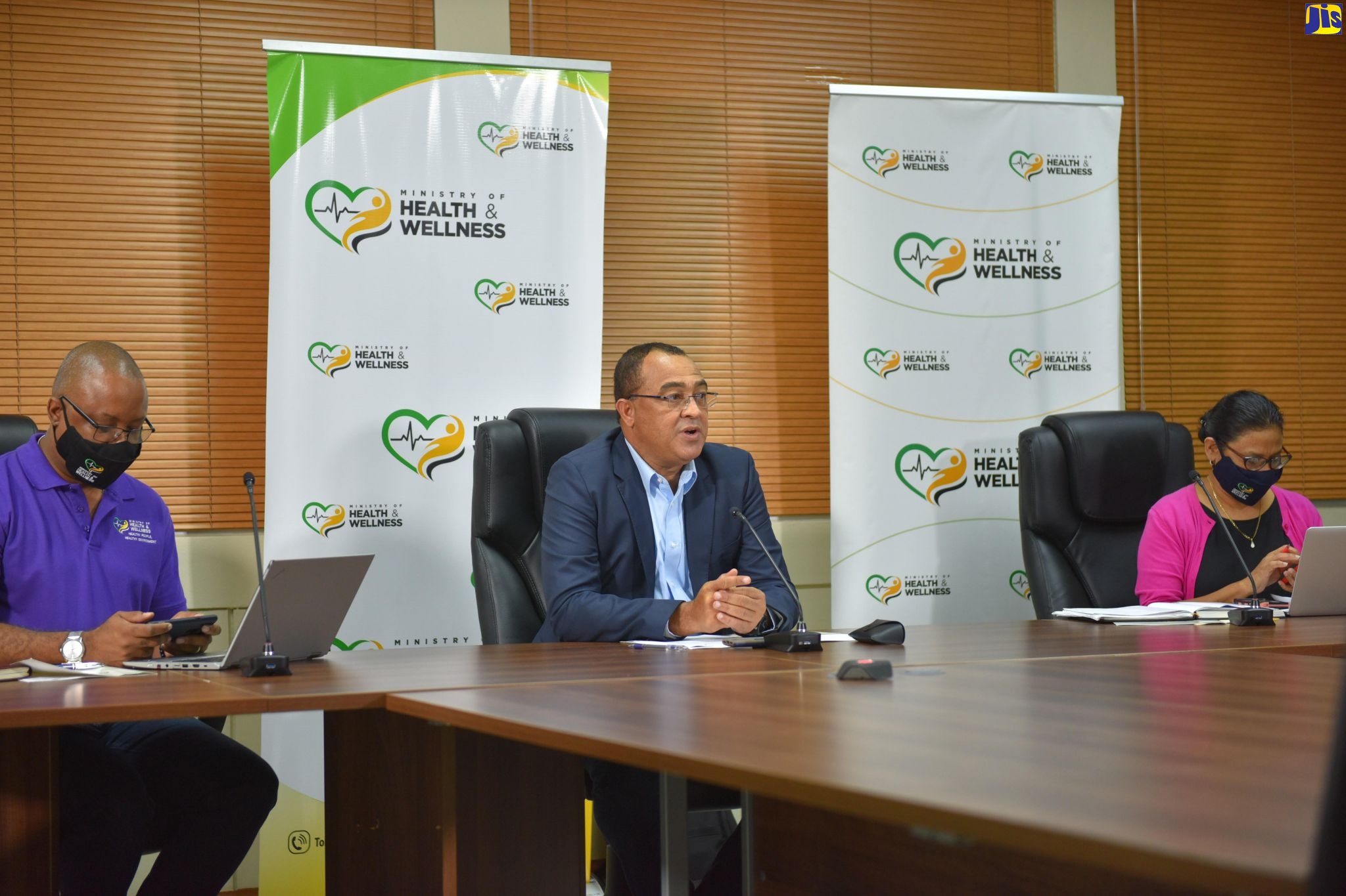 Minister of Health and Wellness, Dr. the Hon. Christopher Tufton (centre) gives an update on coronavirus (COVID-19) cases during a virtual press conference, held at the offices of the Ministry, in New Kingston, on Sunday (August 23). Seated beside him are Permanent Secretary, Dunstan Bryan and Chief Medical Officer, Dr. Jacquiline Bisasor McKenzie.