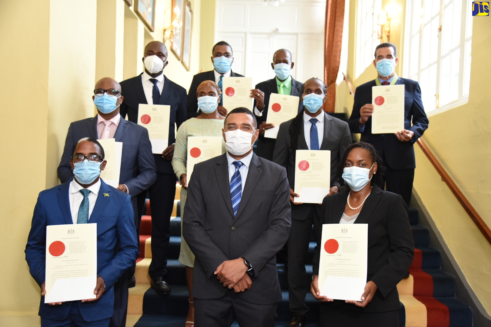 Prime Minister, the Most Hon. Andrew Holness (front row, centre) is flanked by Ministers of State following Monday's (September 14) swearing-in ceremony at King’s House.  


