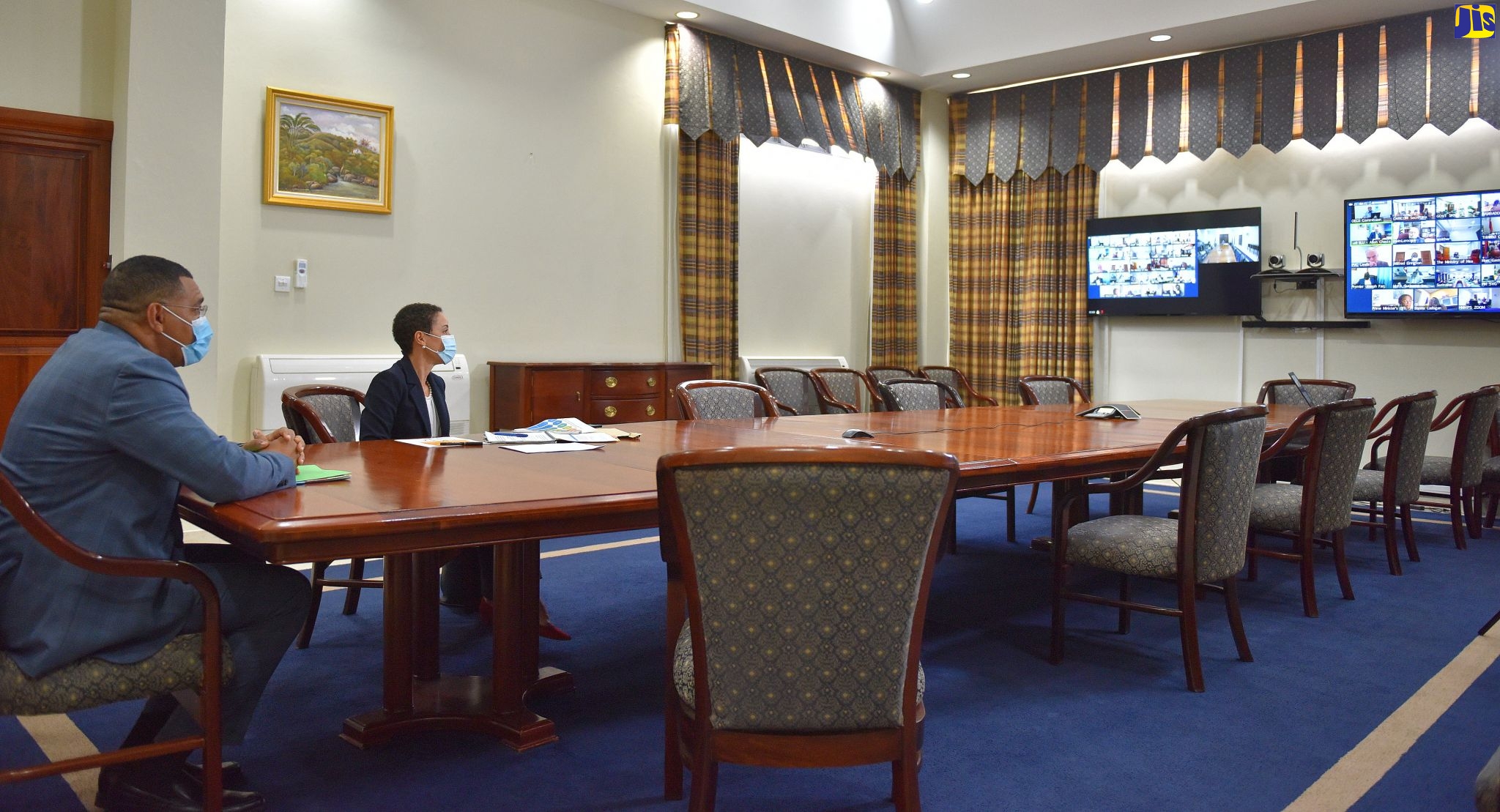 Prime Minister, the Most Hon. Andrew Holness (left), and Minister of Foreign Affairs and Foreign Trade,  Senator the Hon. Kamina Johnson Smith, listen to the input of participants in the 12th Special Emergency Meeting of the Conference of Heads of Government of CARICOM, which was held virtually, on Friday (September 11).