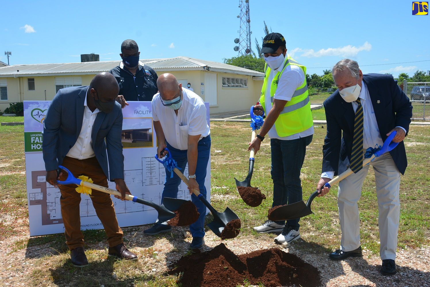 Minister of Health and Wellness, Dr. the Hon. Christopher Tufton (third left), breaks ground for the construction of a field hospital at the Falmouth Public General Hospital in Trelawny, on Friday, September 25. He is joined by (from left): Mayor of Falmouth, Councillor Colin Gager; Managing Director of Rogers Land Development Limited, Richard Rogers; and Custos Rotulorum for Trelawny, Paul Muschett. Observing is Director of the Western Regional Health Authority (WRHA), Errol Greene.