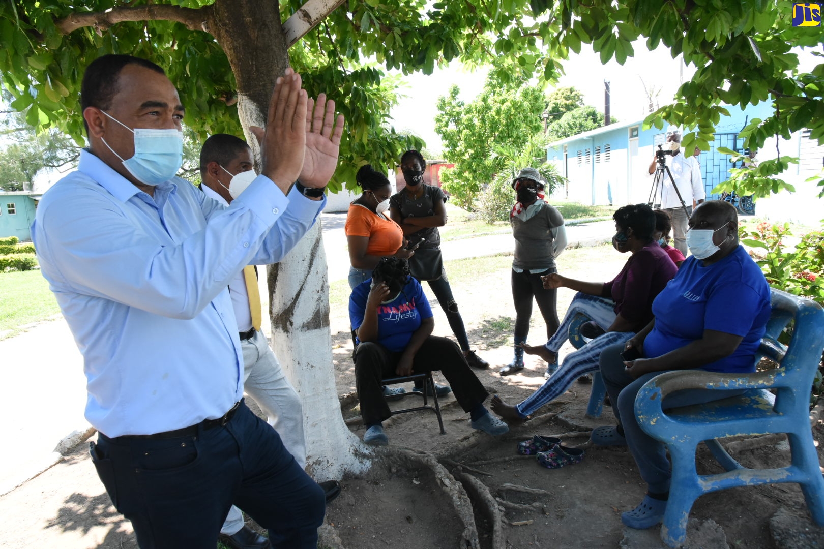 Health and Wellness Minister, Dr. the Hon. Christopher Tufton, speaks with residents and staff at the Golden Age Home, Vineyard Town, St. Andrew, during an inspection of the facility on Monday (September 28).
