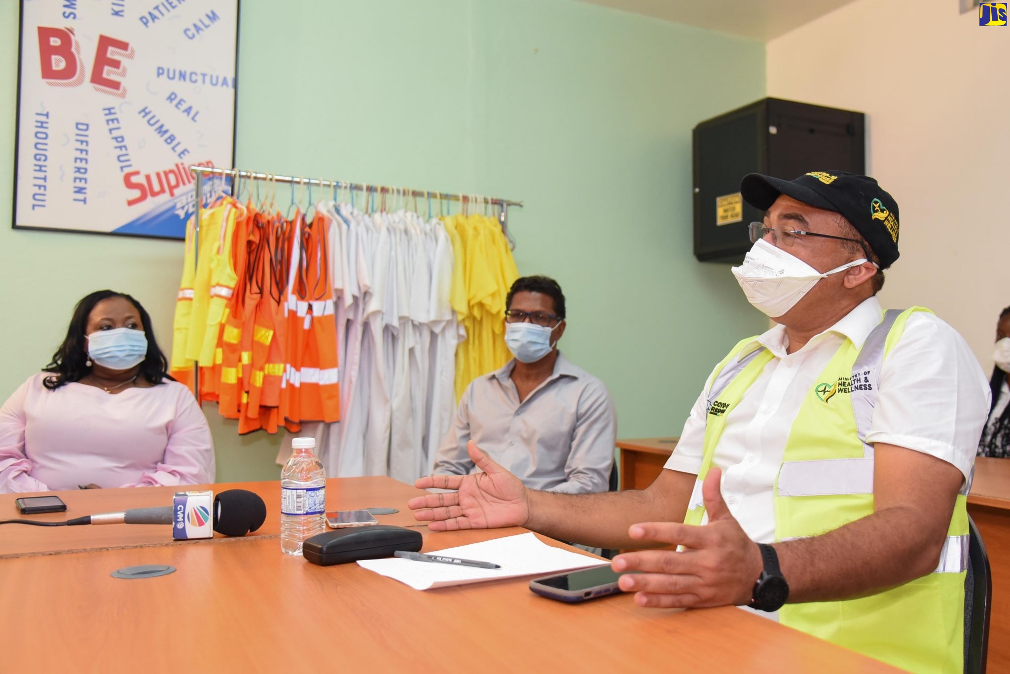 Minister of Health and Wellness, Dr. the Hon. Christopher Tufton (right), addresses management and staff of the Seprod Group of Companies in Bog Walk, St. Catherine, on September 22. With Minister (from left) are Member of Parliament for St. Catherine North Central, Natalie Neita (left), and Group Chief Executive Officer of the company, Richard Pandohie.