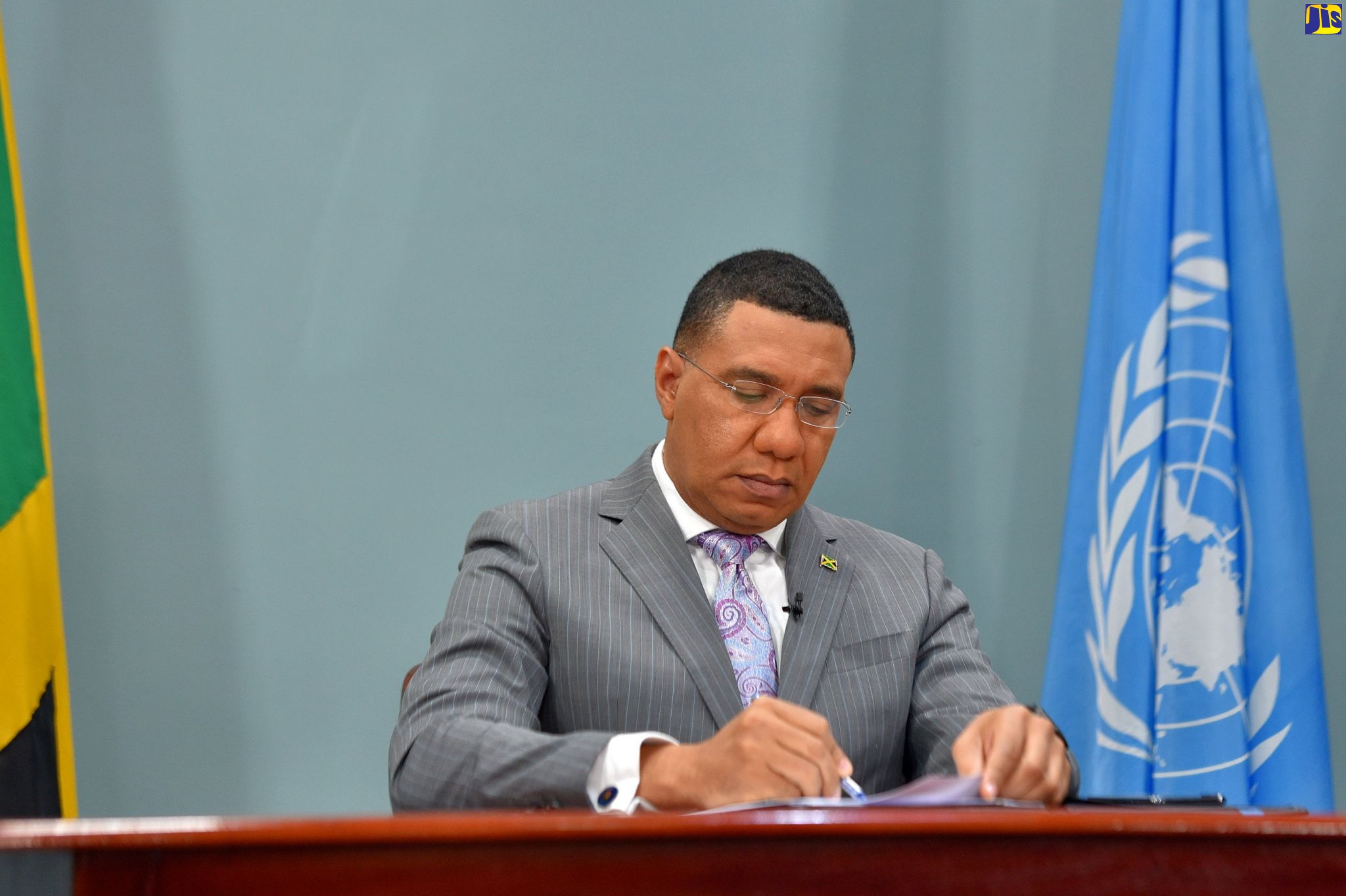 Prime Minister, the Most Hon. Andrew Holness, mskes notes to his speech before addressing the virtual High-Level Meeting of Heads of State and Government on