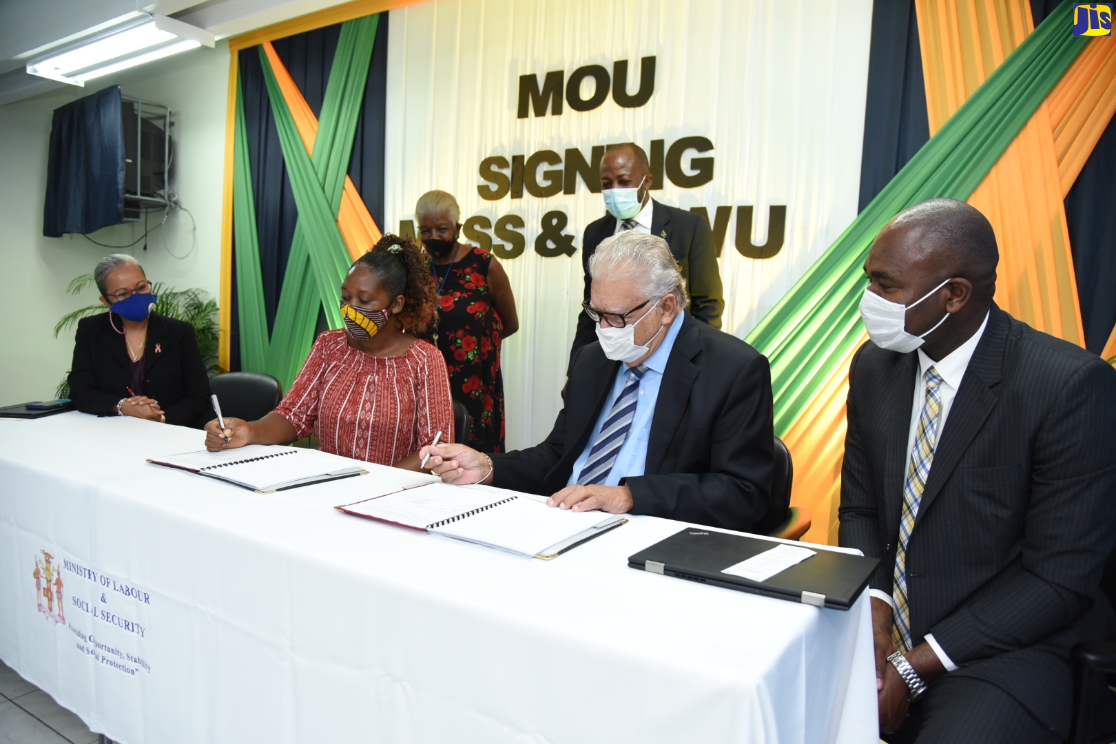 Minister of Labour and Social Security, Hon. Karl Samuda (second right) and Executive Member of the Jamaica Household Workers