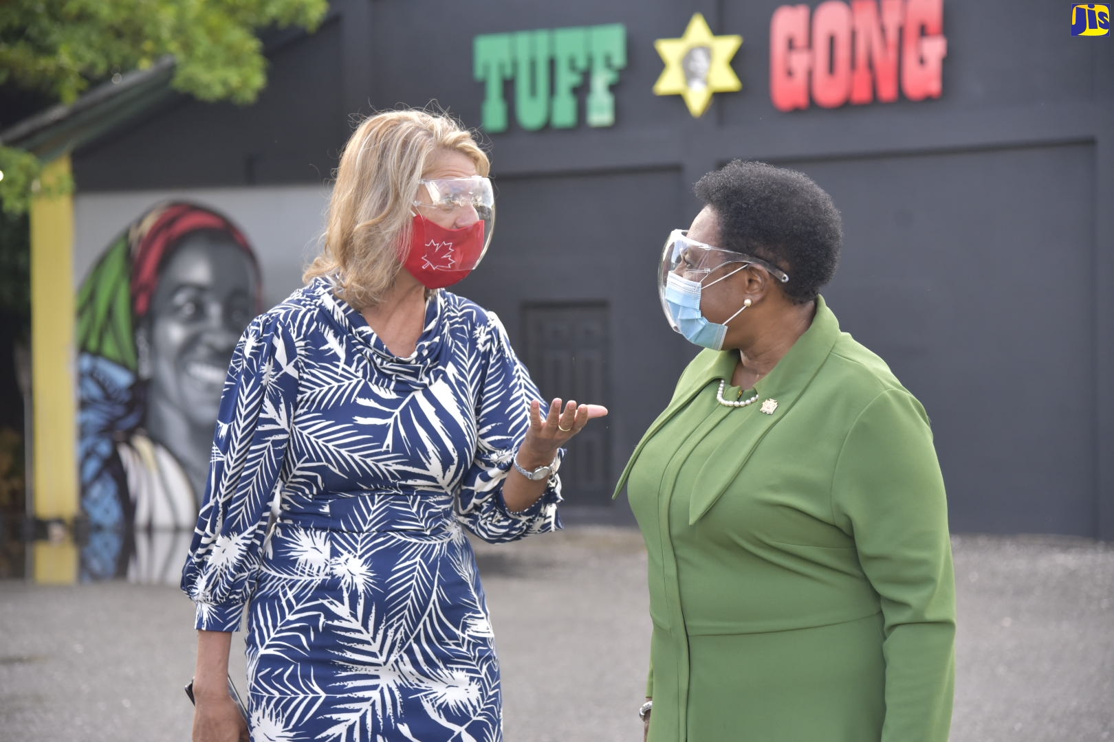 Minister of Culture, Gender, Entertainment and Sport, Hon. Olivia Grange (right), converses with Canadian High Commissioner to Jamaica, Her Excellency Laurie Peters, following a tour of Tuff Gong Studios located at 220 Marcus Garvey Drive, Kingston, on Wednesday (October 14). The tour was to get a first-hand look at the modernised vinyl record pressing system at the famous studio and the upgrading work being undertaken by Canadian company, Vinyl Technologies.

