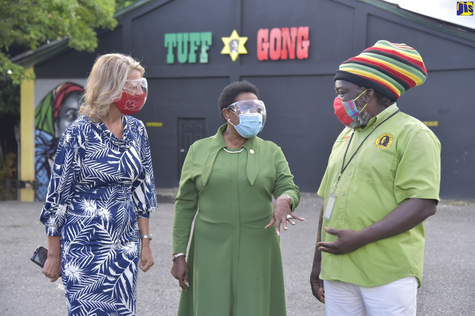 Minister of Culture, Gender, Entertainment and Sport, Hon. Olivia Grange (centre), makes a point to tour guide at Tuff Gong Studios, Ricky Chaplin,  following a tour of  the facility at 220 Marcus Garvey Drive on Wednesday (October 14). Listening is Canadian High Commissioner to Jamaica, Her Excellency Laurie Peters.The tour was to get a first-hand look at the modernised vinyl record pressing system at the studio and the upgrading work being undertaken by Canadian company, Vinyl Technologies.

