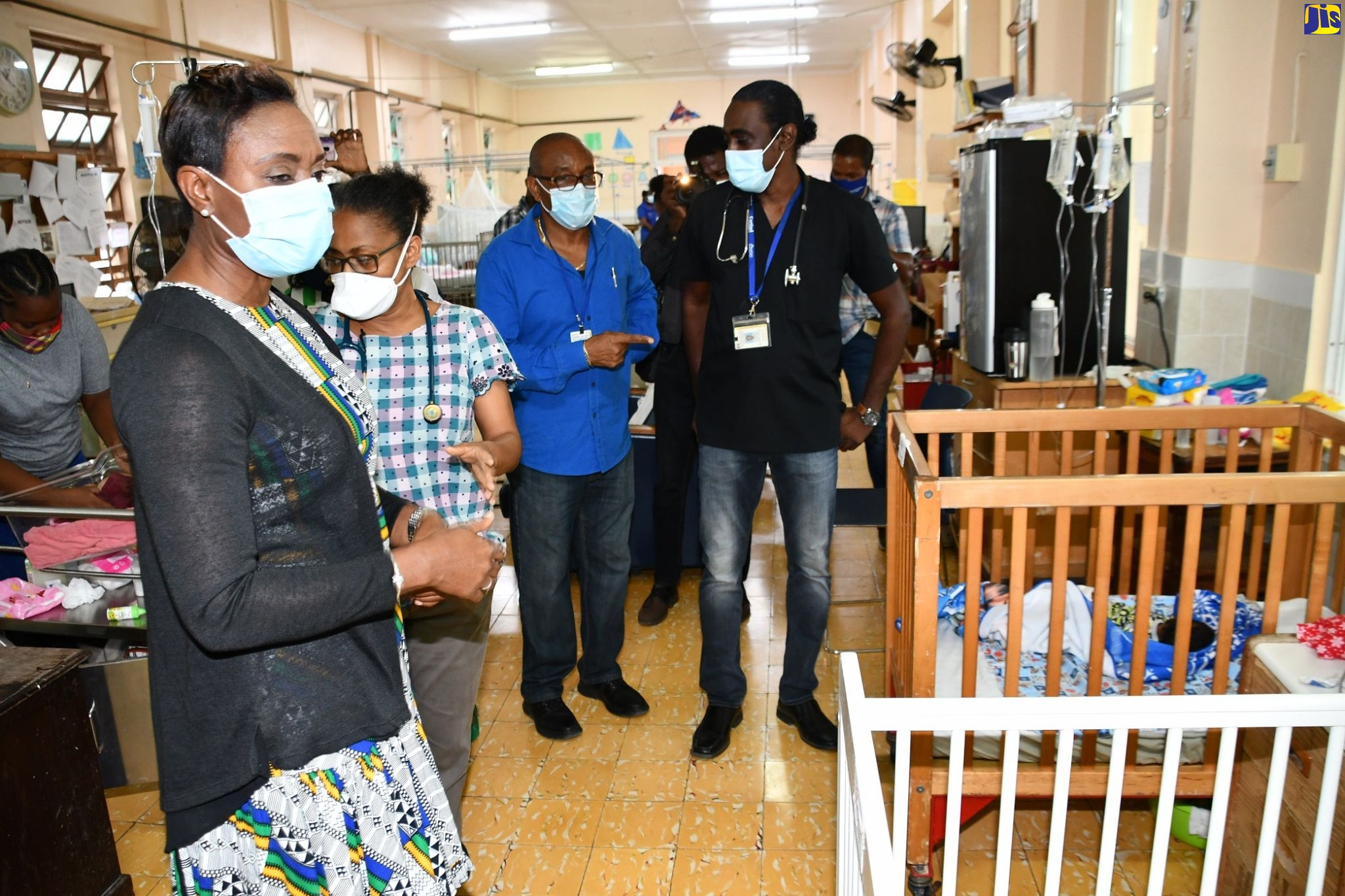 State Minister in the Ministry of Health and Wellness, Hon. Juliet Cuthbert Flynn (left), visits the paediatric ward of the Black River Hospital in St. Elizabeth during a tour of the Type C facility on Friday (October 23). She was accompanied by (from 2nd left) Pediatric Resident of the hospital, Dr. Celeita Senior; Parish Manager for St. Elizabeth Health Services, Sean Brissett; and Senior Medical Officer of the hospital, Dr. Sheriff Imoru.