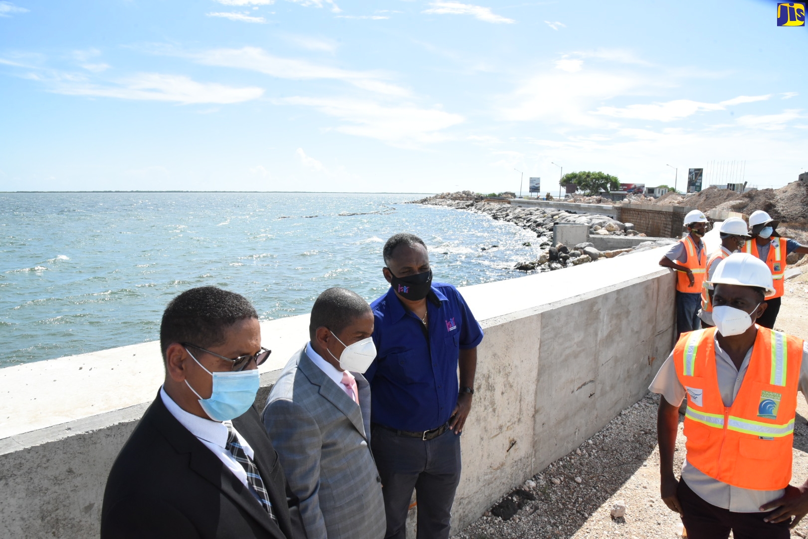 Member of Parliament for Central Kingston, Donovon Williams (left); Mayor of Kingston, Senator Councillor, Delroy Williams (second left); and Managing Director, Jamaica Social Investment Fund (JSIF), Omar Sweeney (third left), tour the Port Royal Street Coastal Revetment Project along Port Royal Street, downton,Kingston on Tuesday (September 29). Also pictured is Managing Director for coastal engineering firm, Smith Warner International, Jamel Banton.