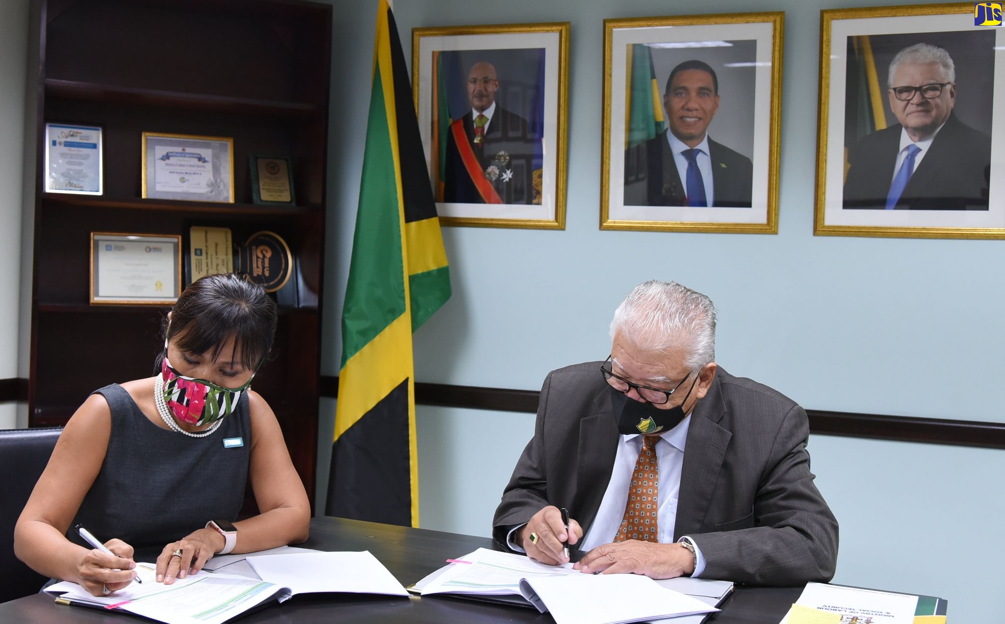 Minister of Labour and Social Security, Hon. Karl Samuda (right) and United Nations Children