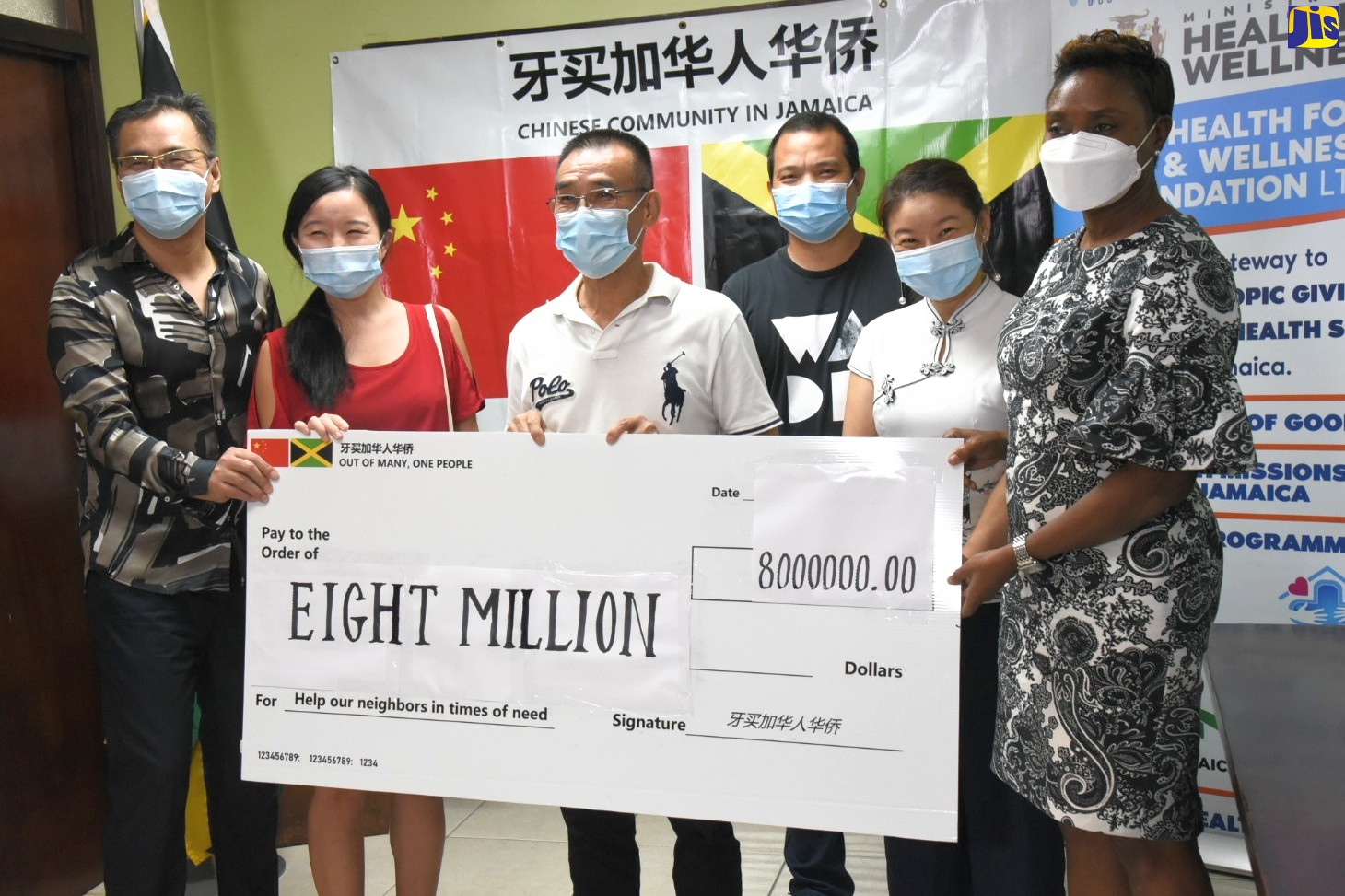 State Minister in the Ministry of Health and Wellness, Hon. Juliet Cuthbert Flynn (right), accepts a cheque for $8 million from representatives of the Chinese community in Jamaica, at the Ministry’s New Kingston location on Wednesday (November 11) . The funds are in support of the Government’s coronavirus (COVID -19) response.