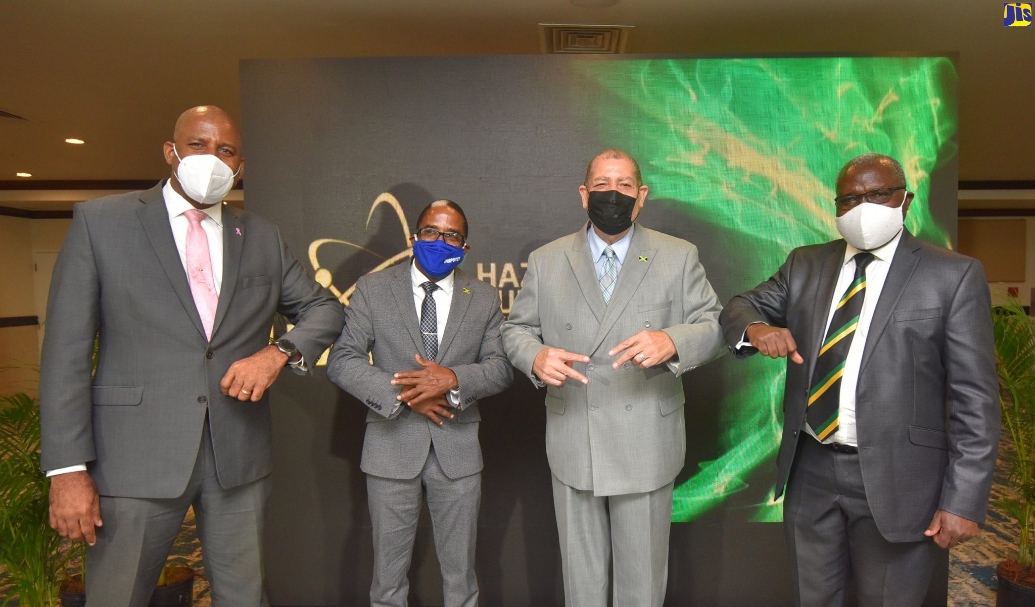 Minister of Industry, Investment and Commerce, Hon. Audley Shaw (second right), exchanges greetings with (from left): Director General and Chairman of the Planning Institute of Jamaica (PIOJ), Dr. Wayne Henry; State Minister in the Ministry, Hon. Dr. Norman Dunn; and Chairman of the Hazardous Substances Regulatory Authority (HSRA), Professor Ishenkumba Kahwa. The occasion was the virtual launch of the HSRA on October 29.