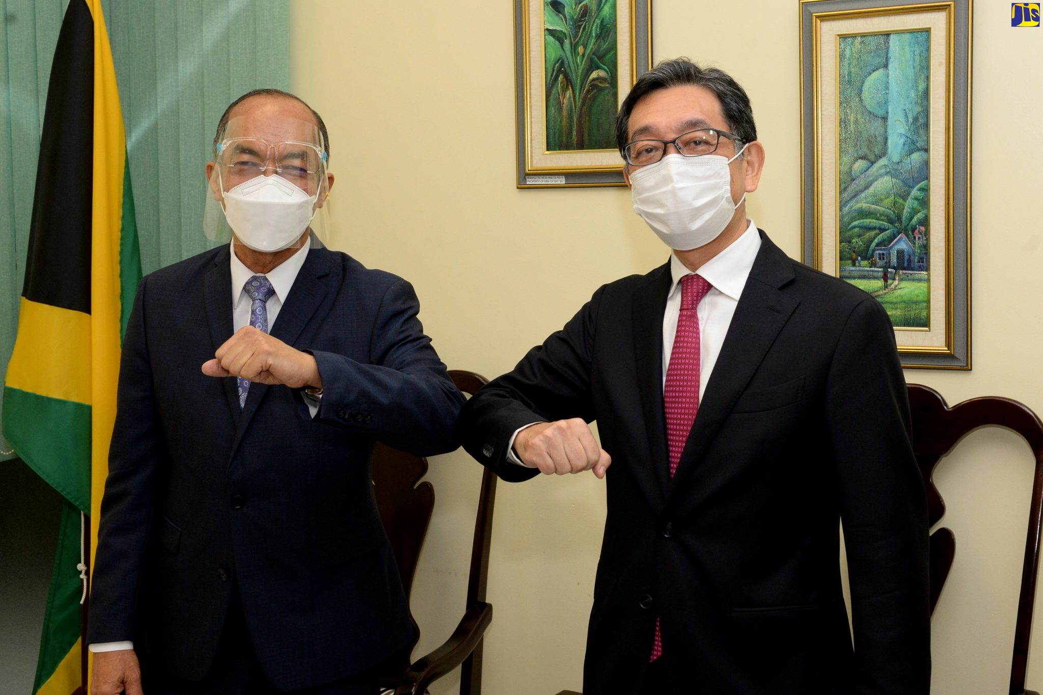 Deputy Prime Minister and Minister of National Security, Hon. Dr. Horace Chang (left), greets Ambassador of Japan to Jamaica, His Excellency Masaya Fujiwara, when the Ambassador called on him at the Ministry in New Kingston, on November 11.