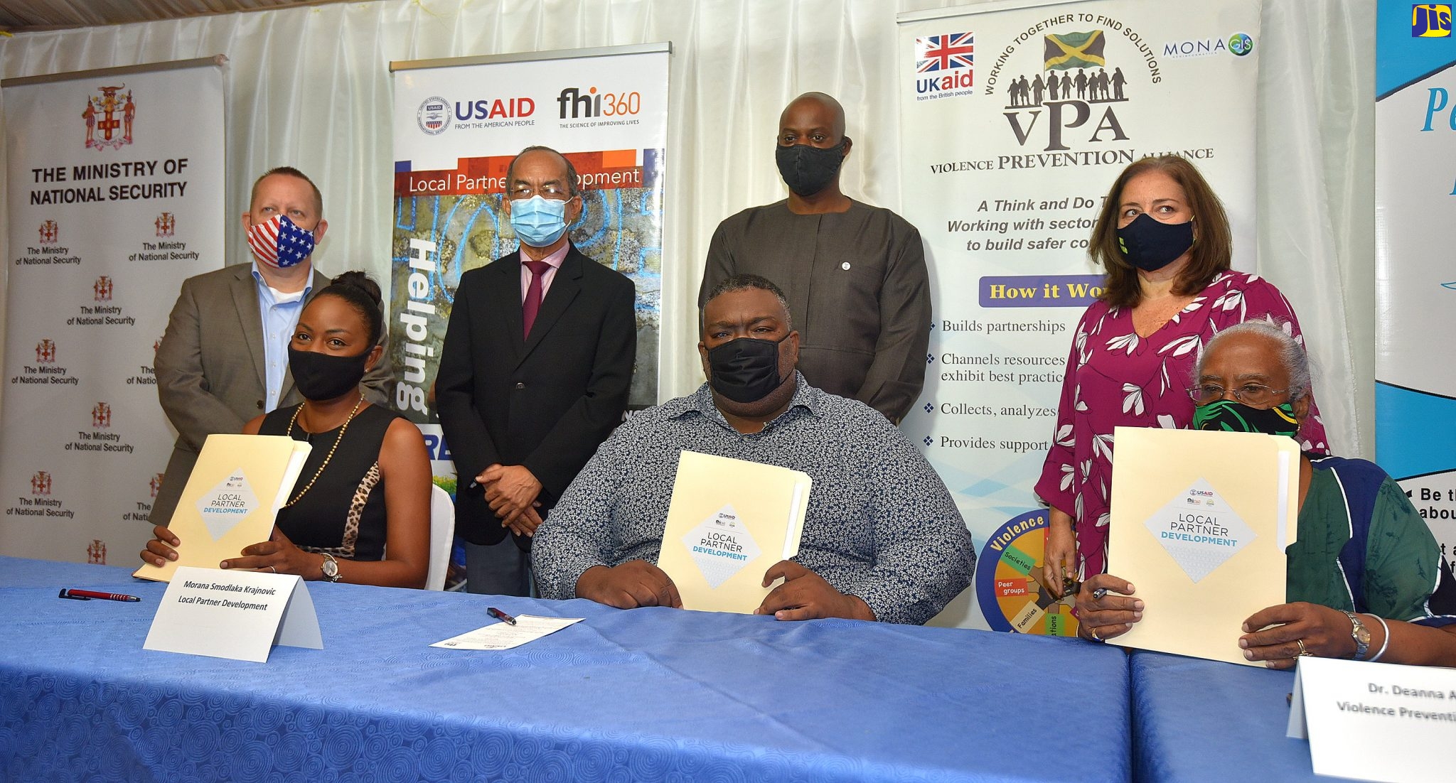 Minister of National Security, Hon. Dr. Horace Chang (standing second left), participates in the grant signing ceremony and launch of the United States Agency for International Development (USAID)-funded Local Partner Development (LPD) Programme at the Terra Nova All-Suite Hotel in St. Andrew on November 19. He is joined by (standing from left) Chargé d