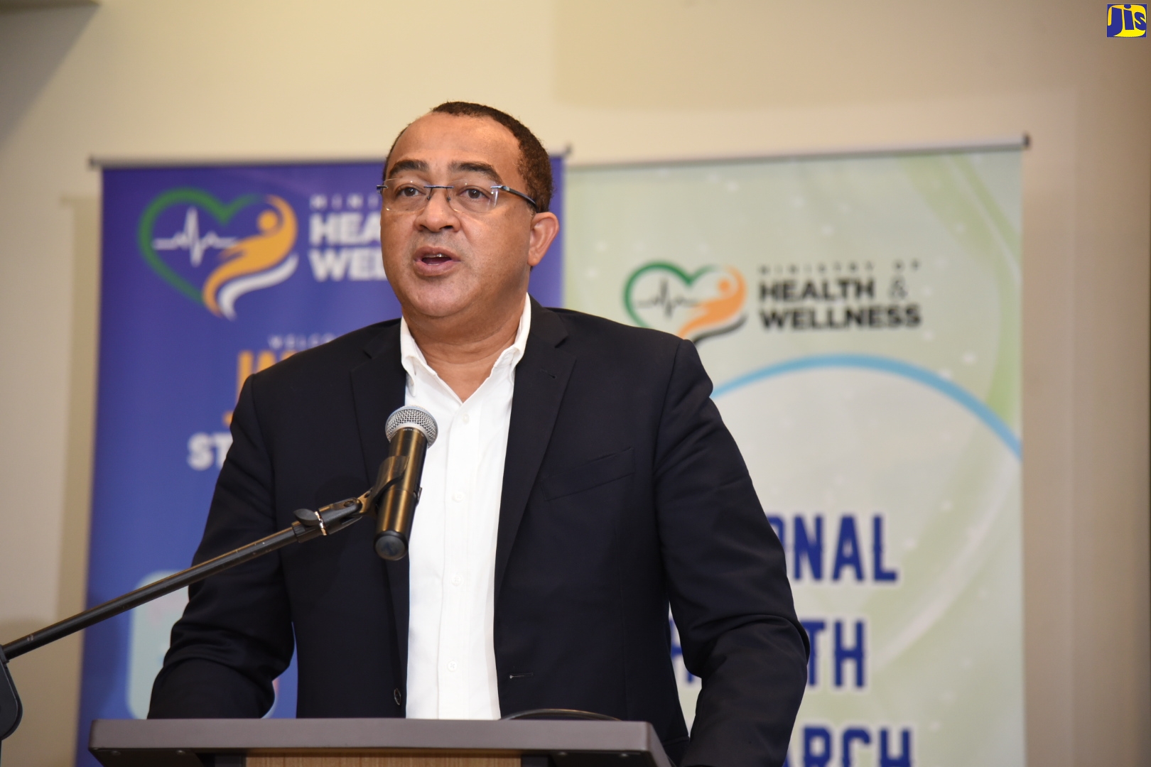 Minister of Health and Wellness, Dr. the Hon. Christopher Tufton, addresses the opening of the 11th Annual Health Research Conference, being held at the Courtyard Marriot hotel in Kingston, from November 19 to 20.