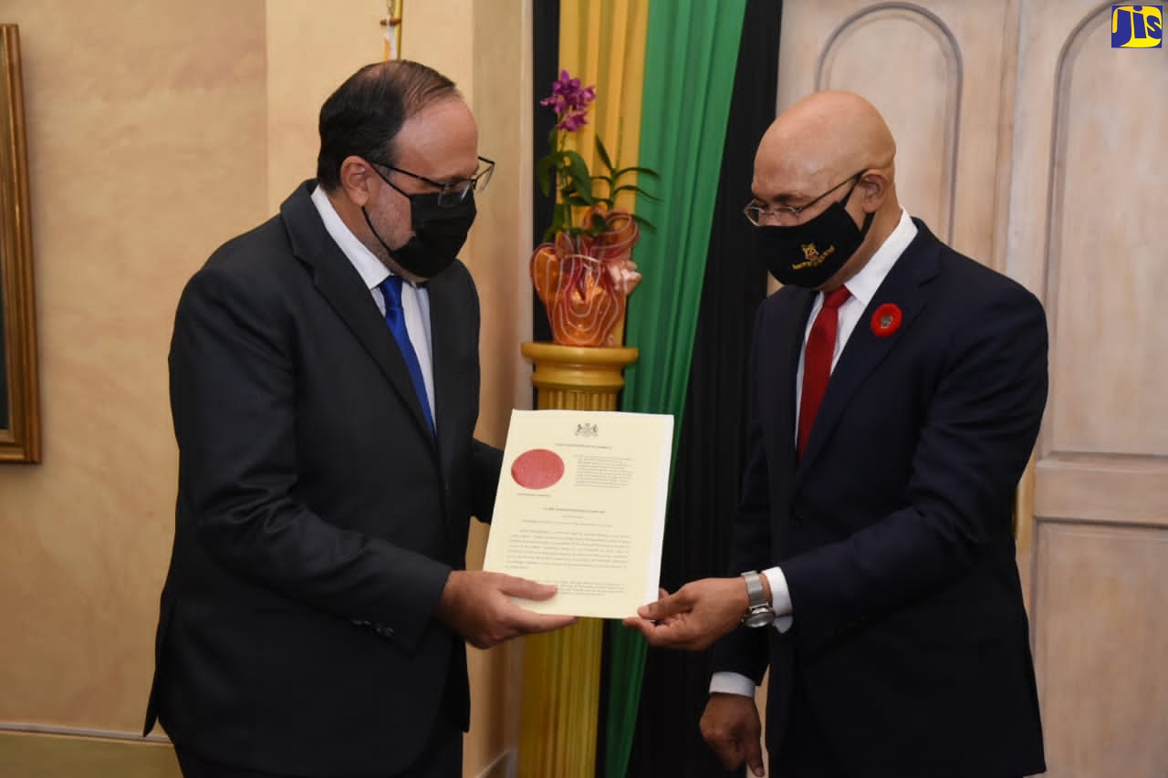 Governor-General, His Excellency the Most Hon. Sir Patrick Allen (right), presents Member of Parliament (MP) for South St. Andrew, Mark Golding with the Instrument of Appointment as the new Leader of the Opposition, during a ceremony held at King’s House on Tuesday (November 10).
