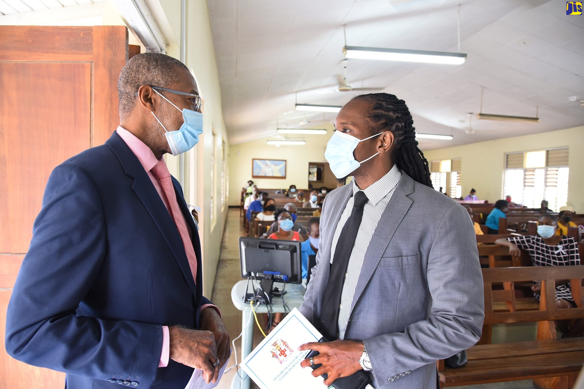 Minister of State in the Ministry of Culture, Gender, Entertainment and Sport, Hon. Alando Terrelonge (right), greets Pastor of the Constant Spring Road Church of God in Kingston, Reverend W. George Lewis. The occasion was the International Men’s Day service held at the church on Sunday (November 15).
