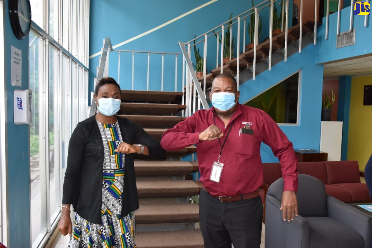 Minister of State in the Ministry of Health and Wellness, the Hon. Juliet Cuthbert Flynn, greets Regional Director for the Southern Regional Health Authority (SRHA), Michael Bent, at the SRHA