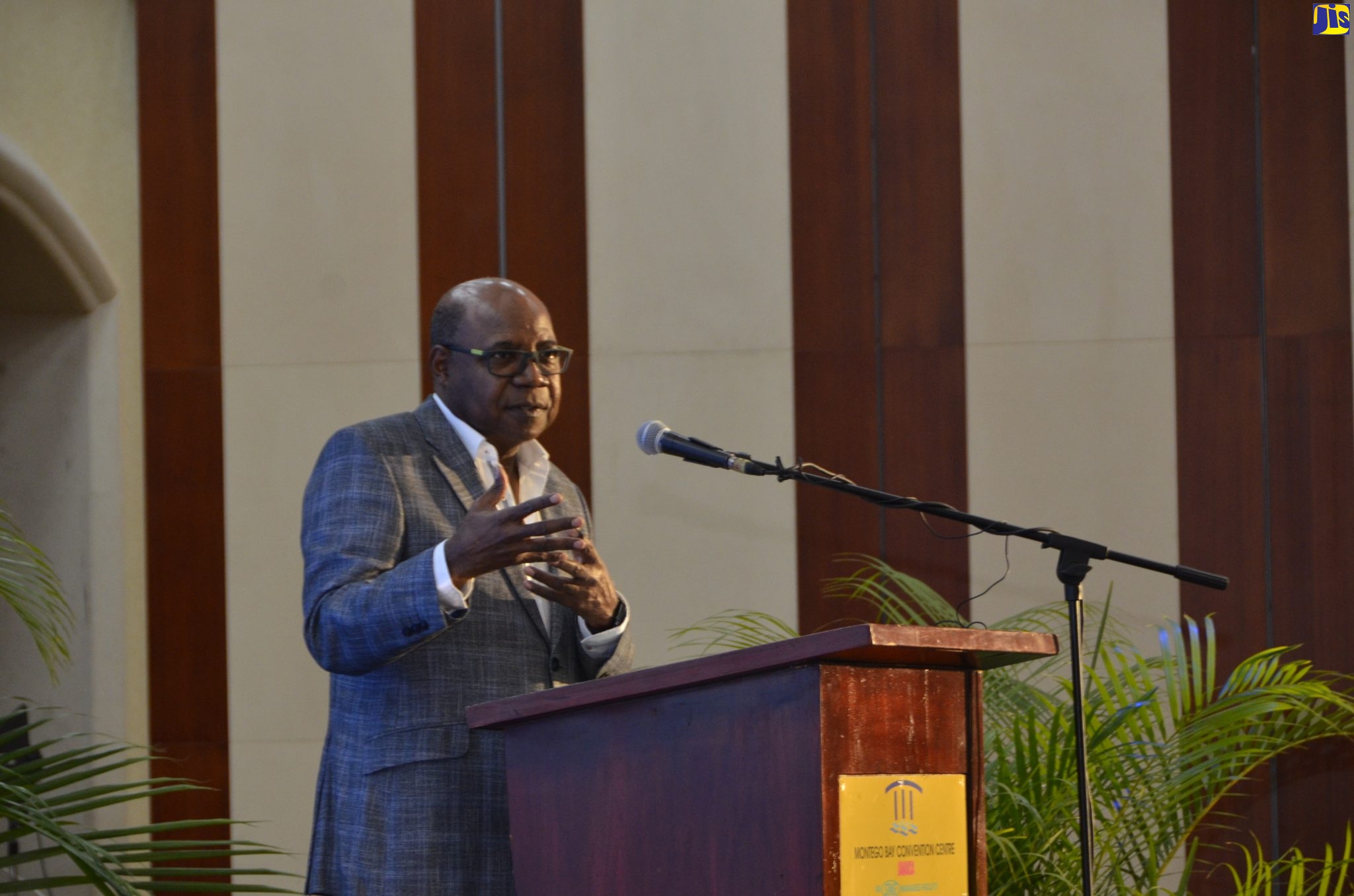 Minister of Tourism, Hon. Edmund Bartlett, addresses Health and Wellness conference, at the Montego Bay Convention Centre, on November 18.