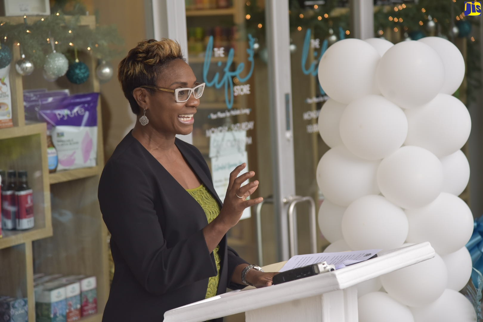 Minister of State in the Ministry of Health and Wellness, Hon. Juliet Cuthbert-Flynn, addresses the opening of the Life Store Wellness Boutique on Constant Spring Road, on Wednesday, December 9.