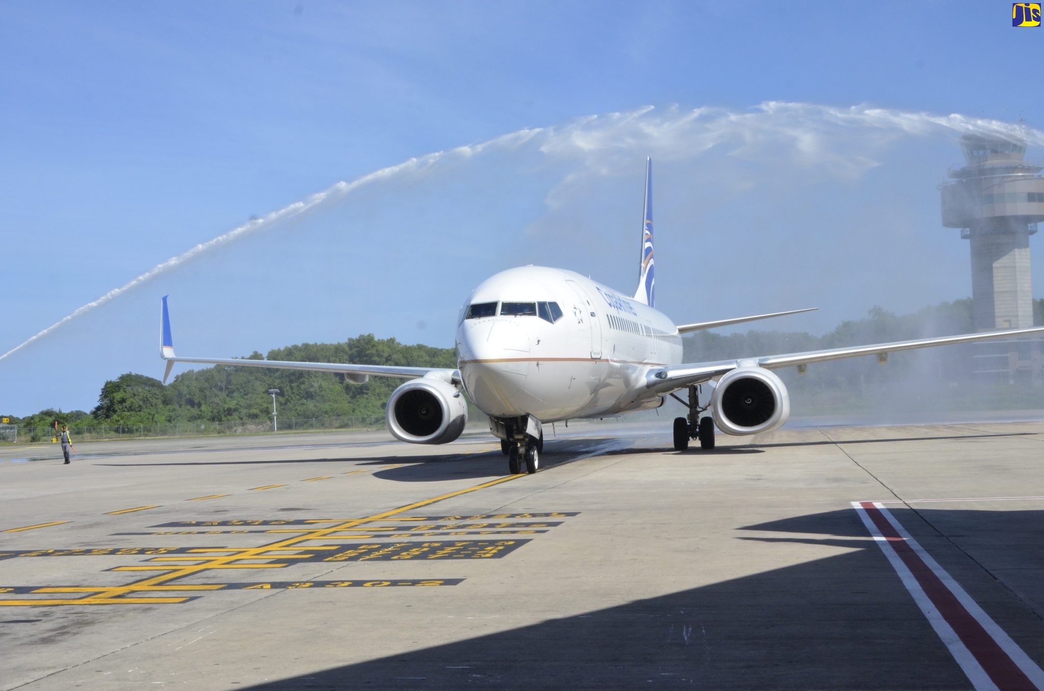 The Copa Airlines flight arriving from Panama City, Panama, taxis beneath the symbolic water arch at the Sangster International Airport in Montego Bay, St. James, as the airline resumed flights to the island on December 7.