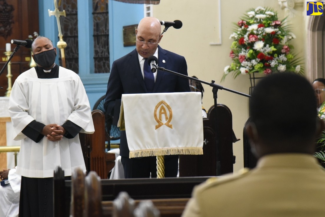 Governor-General, His Excellency, the Most Hon. Sir Patrick Allen (right), reads a lesson during the Jamaica Defence Force (JDF) Annual Carol Service, at the Garrison Church of the Ascension, JDF Headquarters, Up Park Camp, Kingston, on December 8. Looking on is JDF Chaplain, Rev. Major Denston Smalling.