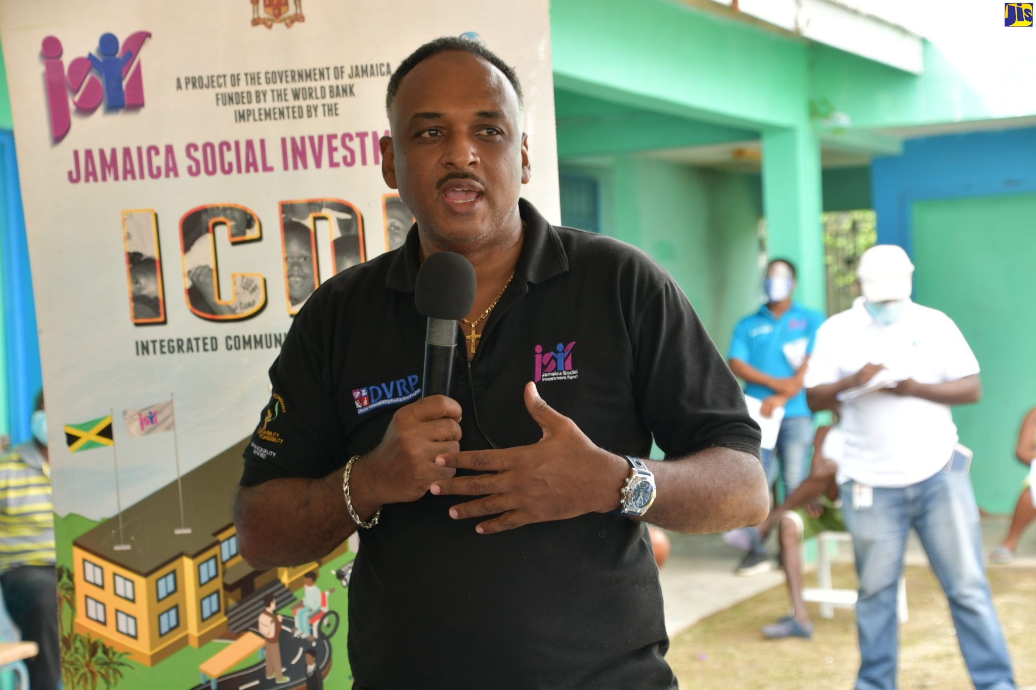 Managing Director of the Jamaica Social Investment Fund (JSIF), Omar Sweeney, addresses a water day event in the community of Russia in  Westmoreland recently. The focus oF the two -day event was the registration of residents for regularisation of their water supply  as well as field plumbing and monitoring activities by water wardens in the community.  