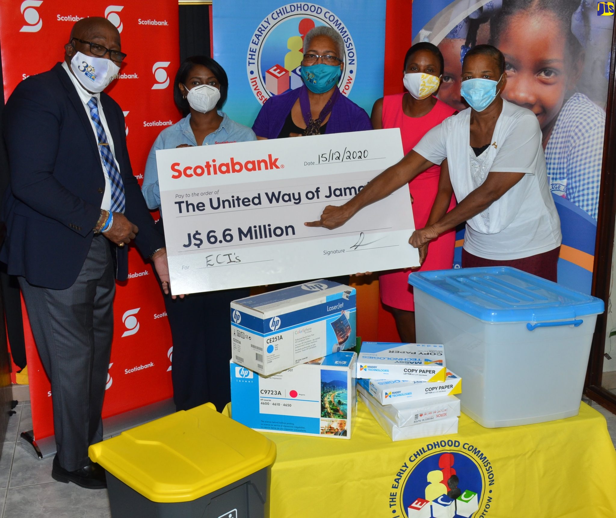 Principal of the Gwen Neil Basic School in St. Catherine, Sandra Young (right), points to the symbolic cheque for $6.6 million for the procurement of equipment and supplies to benefit 51 early-childhood institutions across the island. Occasion was a ceremony for the handover of the items donated by United Way of Jamaica in partnership with Scotia Bank, at the Early Childhood Commission (ECC) in Kingtson on Tuesday (December 15). Sharing the moment (from left) are Immediate Past President, United Way of Jamaica, Ian Forbes; Vice President, Corporate Affairs and Communication, Scotiabank, Yanique Forbes-Patrick; Chief Executive Officer, United Way of Jamaica, Winsome Wilkins; and Chairman, Early Childhood Commission, Trisha Williams-Singh.