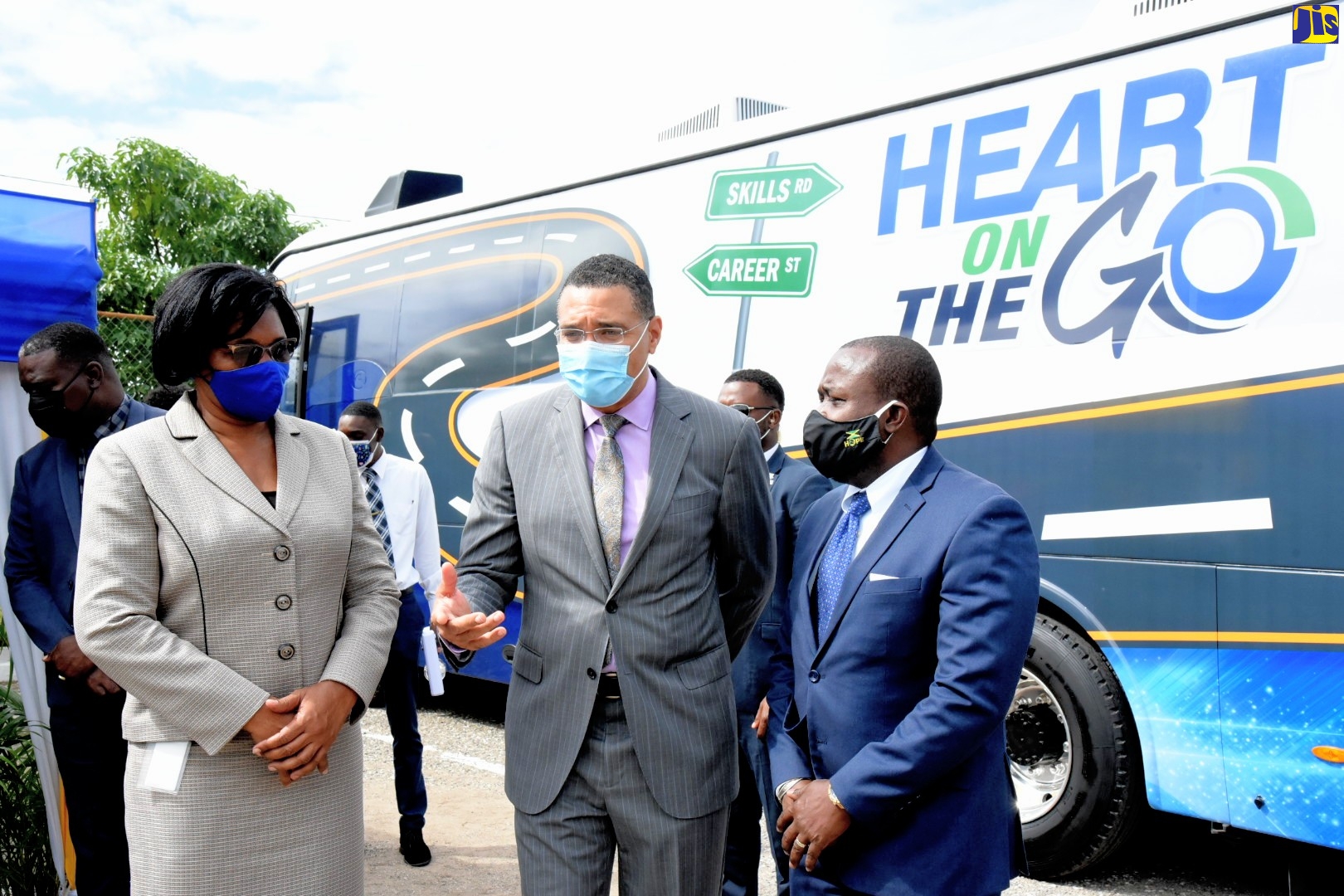 Prime Minister, the Most Hon. Andrew Holness (centre), speaking with Managing Director, HEART/NSTA Trust, Dr. Janet Dyer (left); and Chairman, Board of Directors, HEART/NSTA Trust, Edward Gabbidon, after a tour of the agency