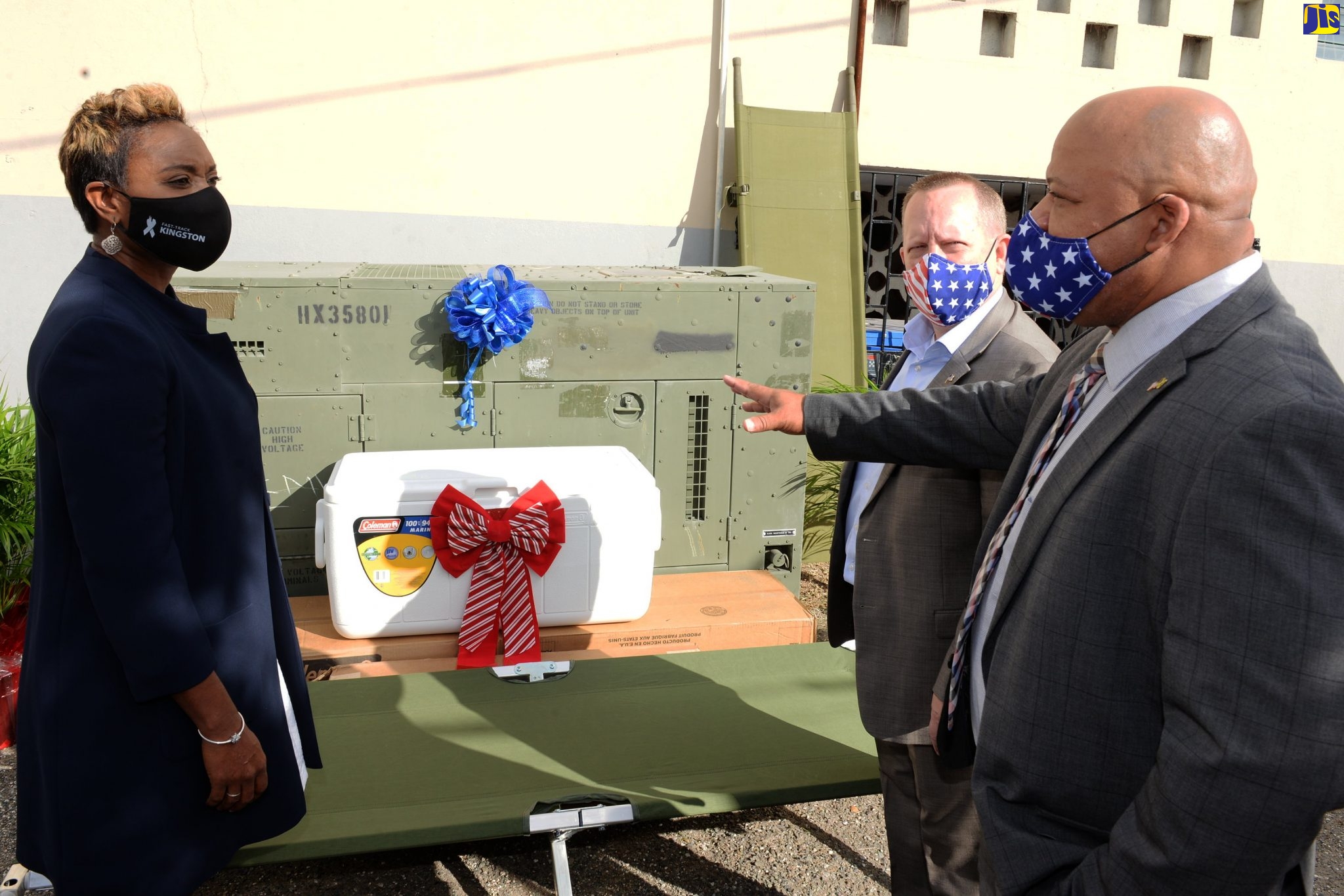 State Minister, Ministry of Health and Wellness, Hon. Juliet Cuthbert Flynn (left) listens attentively to Military Liason, United States Embassy in Kingston, James Rachel (right) during a function for the handover of medical equipment and supplies at the Glen Vincent Health Centre, Kingston, on Thursday (December 10). Also pictured is Chargé d’Affaires, United States Embassy, John McIntyre. The donation, which is valued at more than US$300,000, represents the United States of America’s ongoing support for Jamaica’s coronavirus (COVID-19) response.