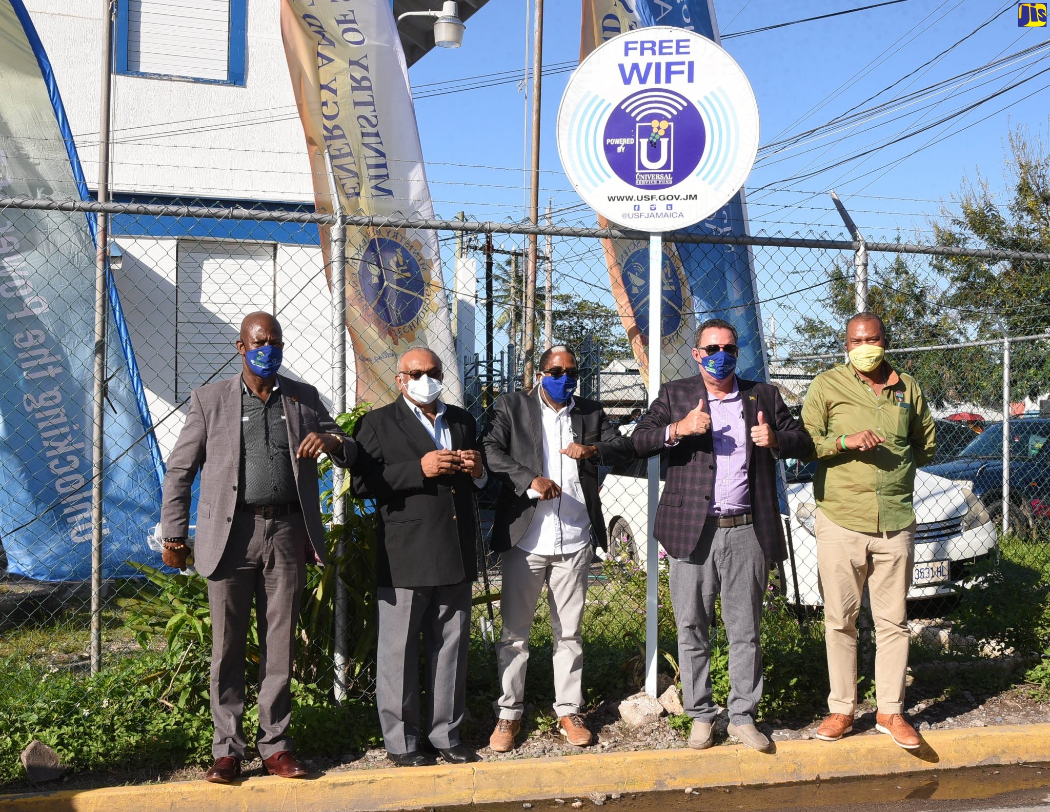 Minister of Science, Energy and Technology, tHon. Daryl Vaz (second right), gives the thumbs-up at the launch of free public Wi-Fi in the town of Annotto Bay, St. Mary, on Friday (November 27).  He is joined by (from left) Chief Executive Officer, Universal Service Fund (USF), Daniel Dawes; Custos of St. Mary, Errol Johnson; State Minister, Ministry of Industry, Investment and Commerce, and Member of Parliament for South East St. Mary, Dr. the Hon. Norman Dunn; and Mayor of Port Maria, Richard Creary.

 