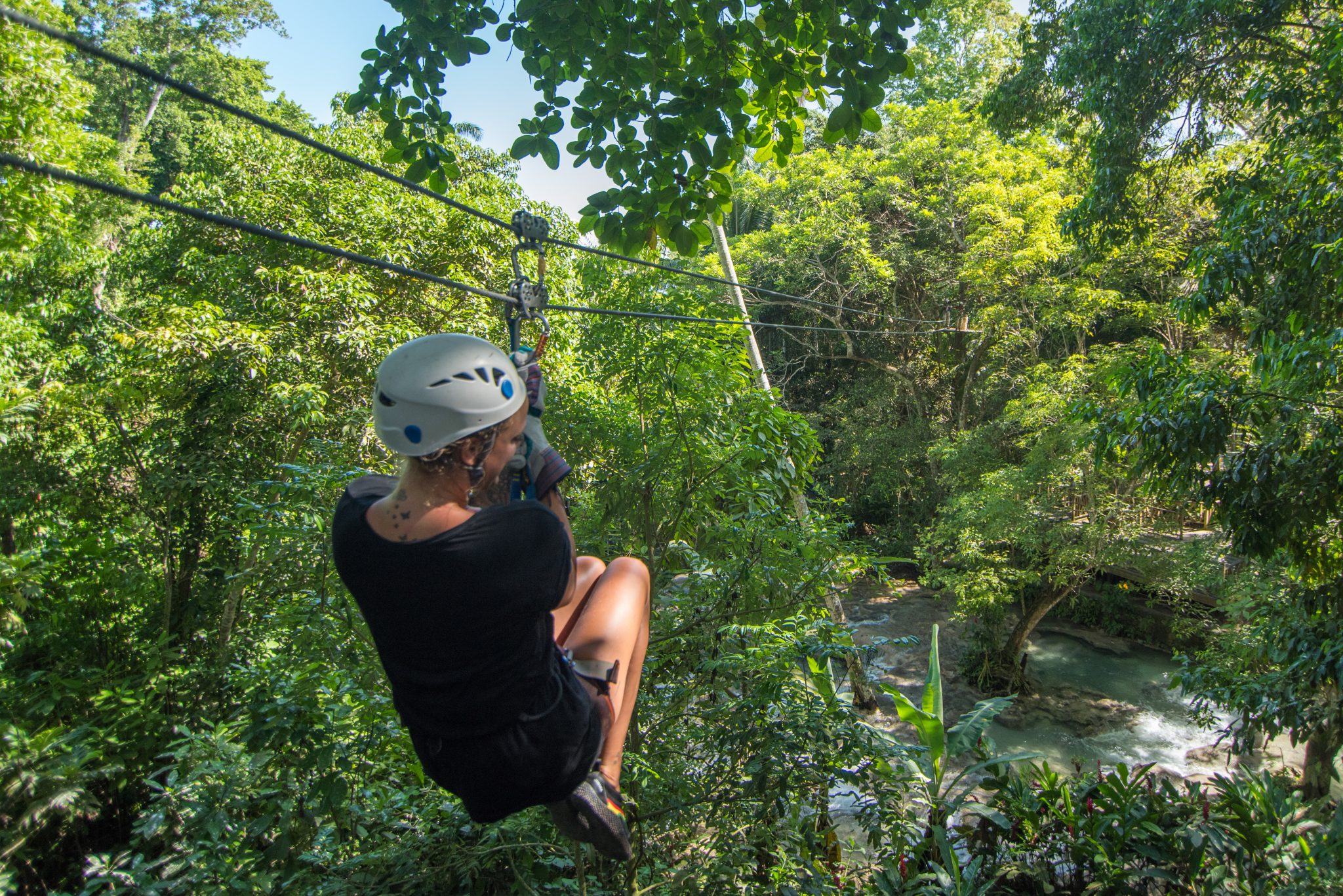 A tourist glides across the Chukka ‘Falls Flyer’ zip line located at Dunn’s River Falls. The Falls Flyer zip line is one of three activities being promoted by the Urban Development Corporation (UDC), via its ‘Triple Thrills’ promotion.

