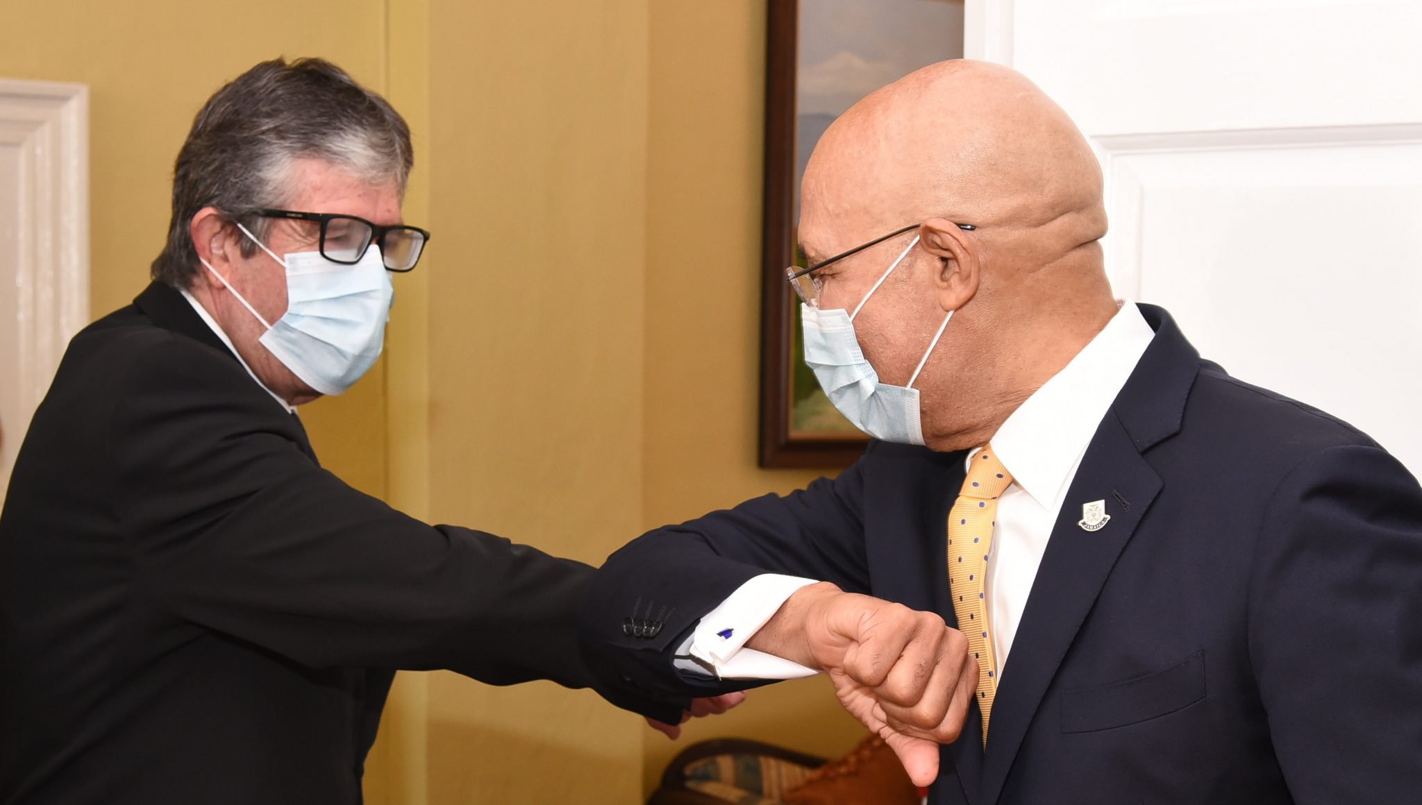 Governor-General, His Excellency the Most Hon. Sir Patrick Allen (left), greets the  Ambassador-designate of the Kingdom of Spain, His Excellency Diego Bermego Romero de  Terroros, when he visited King