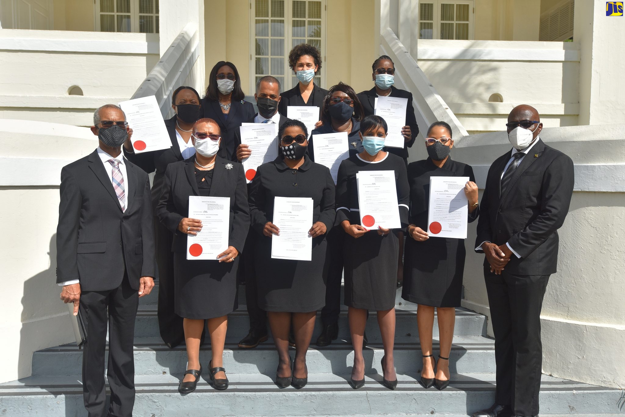 Chief Justice Bryan Sykes (left) and President of the Court of Appeal, Justice Patrick Brooks (right), share a photo opportunity with judges who have been appointed to higher office, at a swearing-in ceremony held at King’s House in St. Andrew on Thursday (January 7).