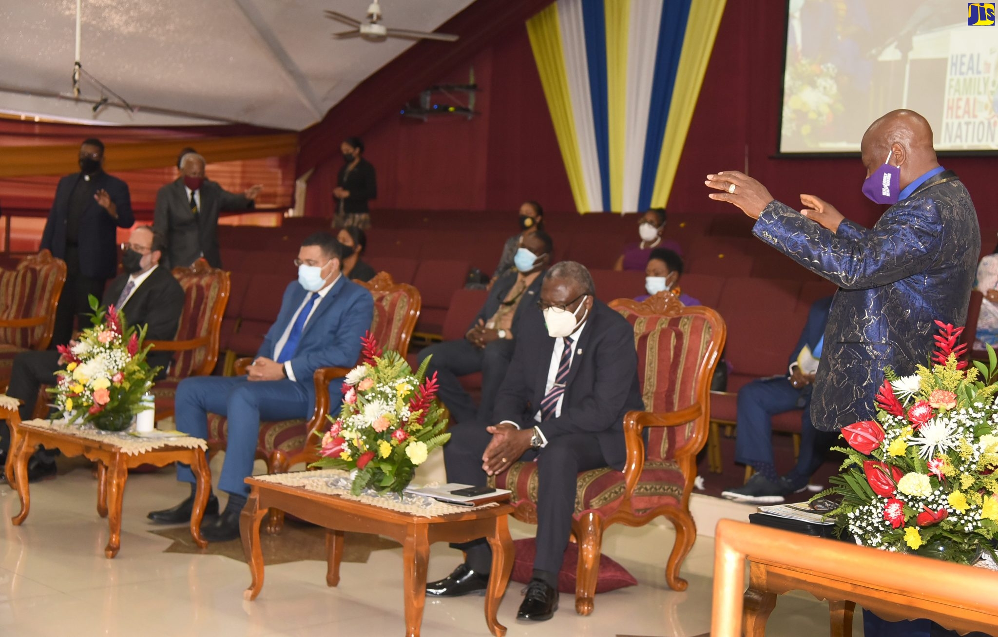 Prime Minister, the Most Hon. Andrew Holness (seated, front row centre); Leader of the Opposition, Mark Golding (seated, front row left); and Custos of St. James, and Co-Chairman of the National Day of Prayer Committee, Bishop Conrad Pitkin, representing Governor-General, His Excellency the Most Hon. Sir Patrick Allen, bow their heads in prayer during the annual service held at the Power of Faith Ministries in Portmore, St. Catherine, on January 6.