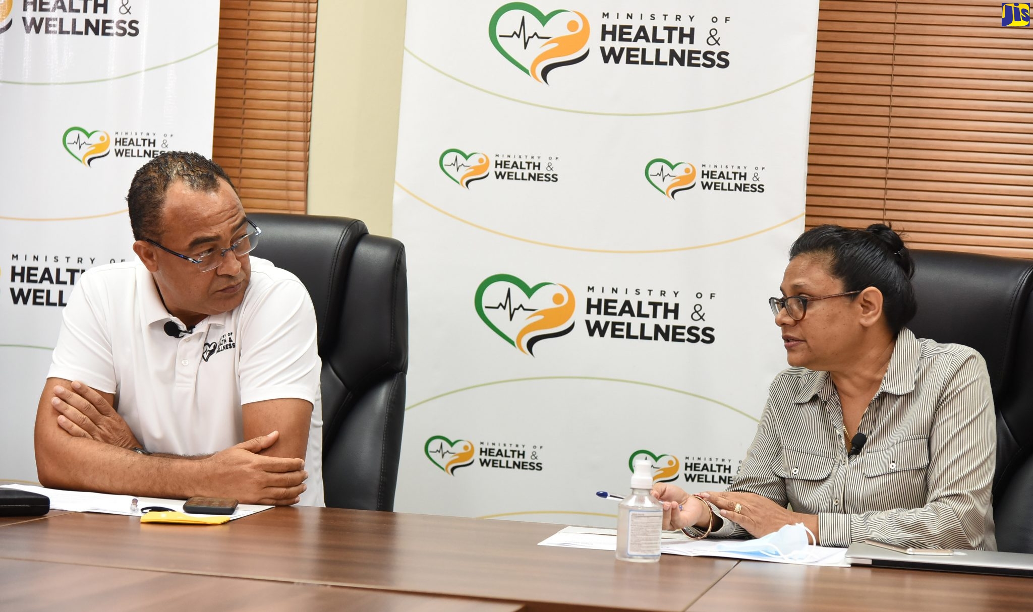 Minister of Health and Wellness. Dr. the Hon Christopher Tufton (left), listens to Chief Medical Officer, Dr. Jacquiline Bisasor-McKenzie, at a virtual press conference, on Saturday (January 2), at the Ministry of Health and Wellness, in Kingston.