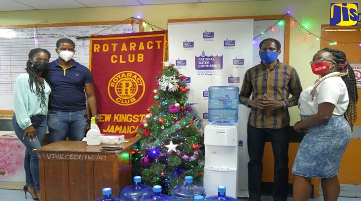Good things flow from a worthy collaboration. NWC and Rotaract Club collaborate to donate water and water cooler to Victoria Jubilee. In this photo from left: Aniska Smith, President of the Rotaract Club; Andrew Canon, Corporate Public Relations Manager NWC, Oshane Allen, Member of the Rotaract Club and Akieba Chambers, Project Coordinator/Lead.