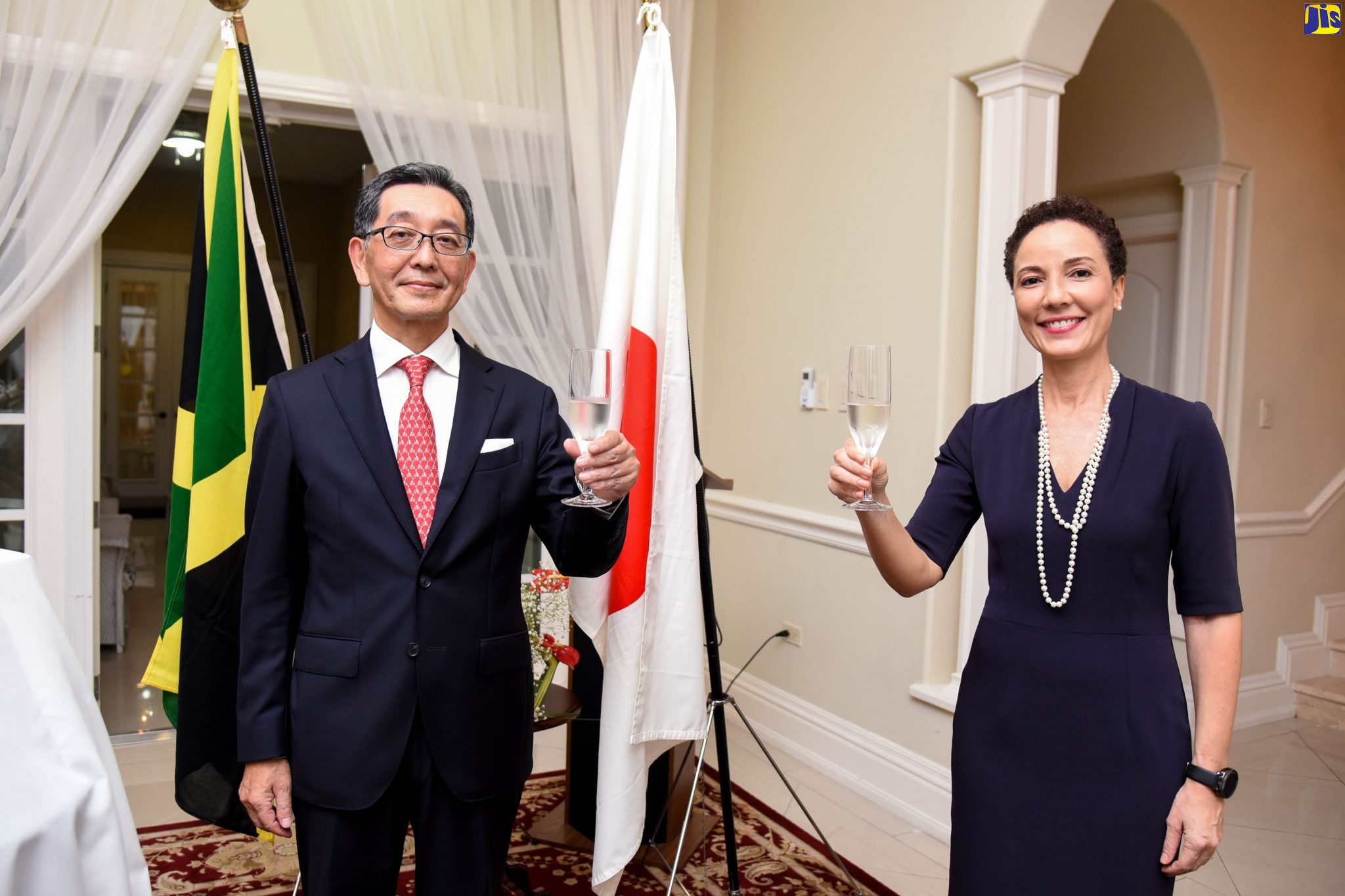 Ambassador of Japan to Jamaica, His Excellency Masaya Fujiwara (left) and Minister of Foreign Affairs and Foreign Trade, Senator the Hon Kamina Johnson Smith, raise a toast to celebrate the 61st birthday of His Majesty the Emperor Naruhito of Japan, during a reception held at the Ambassador’s residence in Kingston, on February 23.