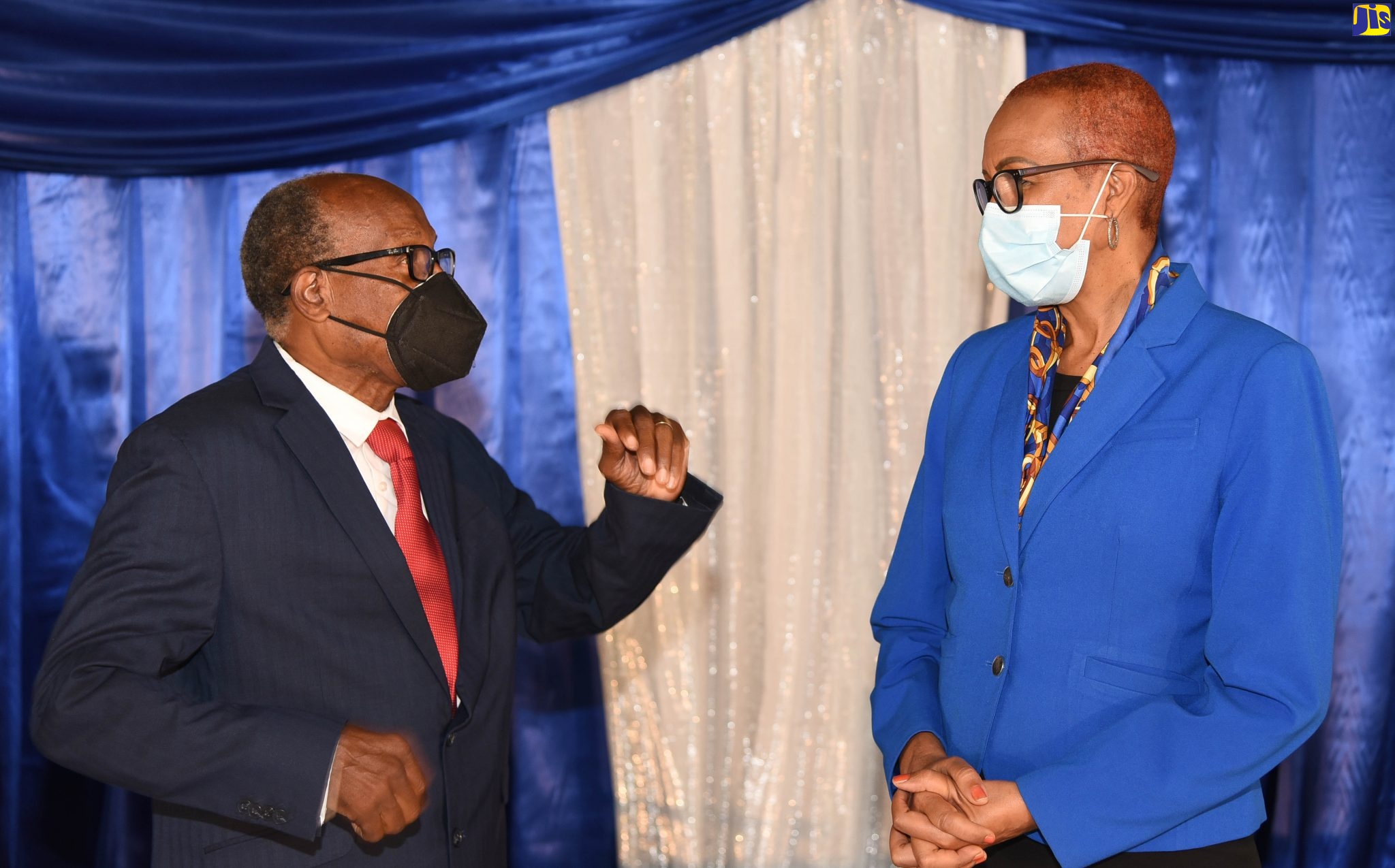 Minister of Education, Youth and Information, Hon. Fayval Williams (right), is in conversation with Chairman of the Cedar Grove Academy in Portmore, St. Catherine, Rev. Dr. Wellesley Blair (left), during a special function held in his honour at the school on Thursday (February 4).