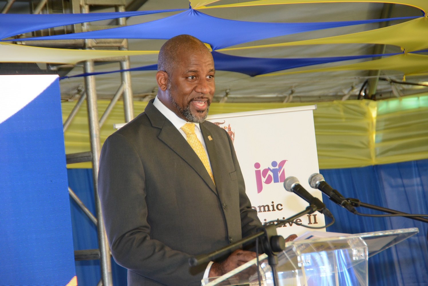Chairman of the Jamaica Social Investment Fund (JSIF), Dr. Wayne Henry, speaks at the handover ceremony of coronavirus (COVID-19) resilient supplies to operators of small agricultural and tourism enterprises in St. Ann and Trelawny, on Thursday (January 28), at Grizzly’s Plantation Cove, at Richmond Estate in St. Ann.​