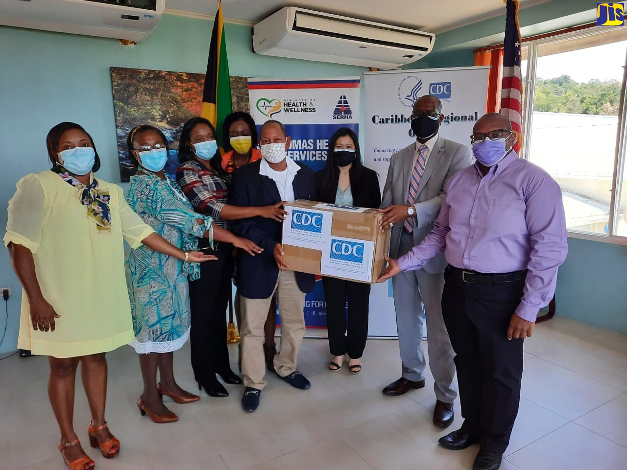 Acting Deputy Chief of Mission at the United States Embassy in Jamaica, Mr. Varough Deyde (2nd right) and Acting Director of the Caribbean Regional Office of the Centers for Disease Control and Prevention (CDC), Ms. Douan Kirivong (3rd right), make a presentation to representatives of the St. Thomas Health Services -
Acting Parish Manager, Mrs. Pauline Ellington (2nd left) and Medical Officer of Health for the parish, Dr. D