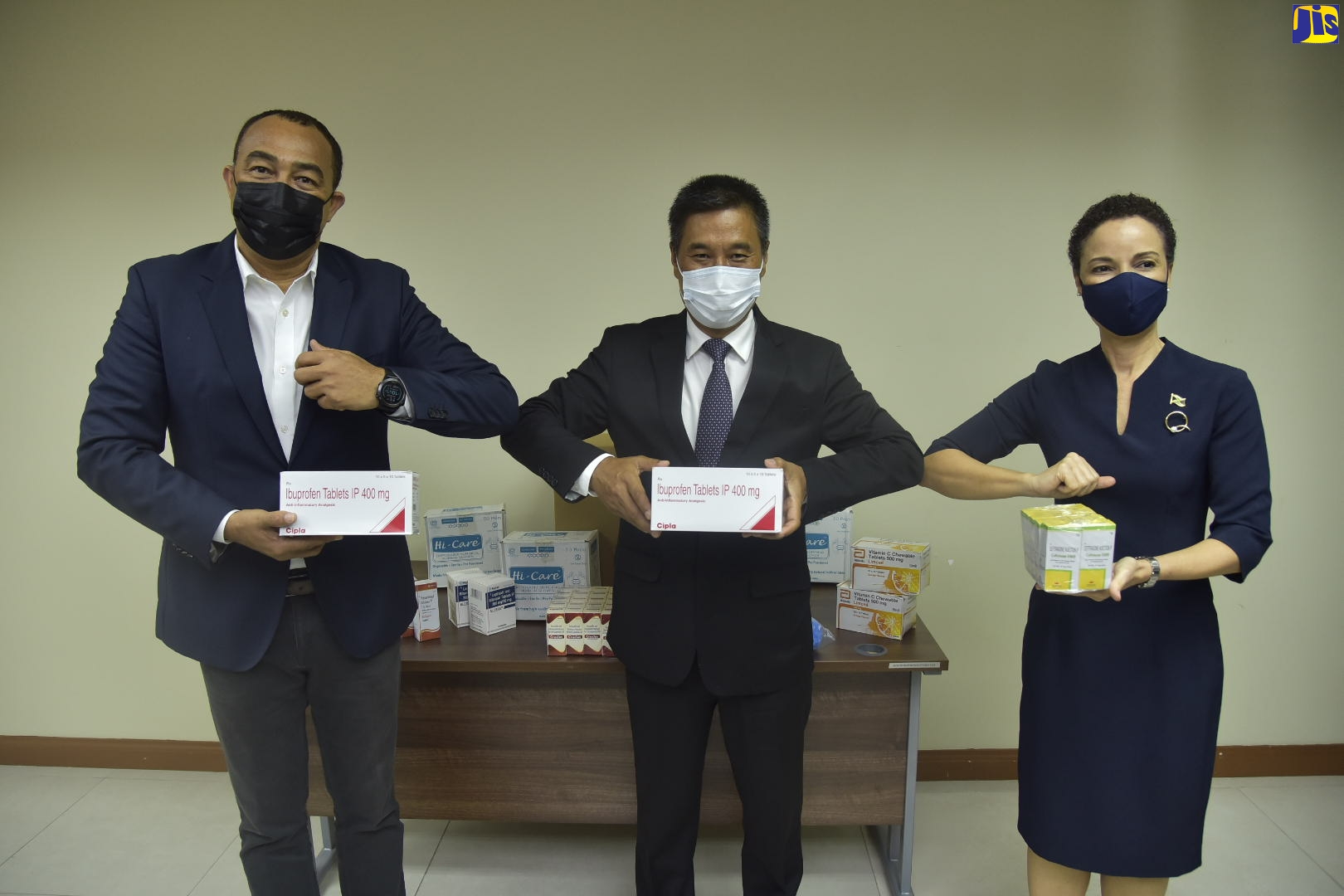 Health and Wellness Minister, Dr. the Hon. Christopher Tufton (left); Indian High Commissioner to Jamaica, His Excellency Ambassador Masakui Rungsung and Minister of Foreign Affairs and Foreign Trade, Senator the Hon. Kamina Johnson Smith, holding samples of pharmaceutical medicines and supplies donated by the Government of the Republic of India to assist with the local COVID-19 response. The supplies are valued at approximately $13.5 million. The official handover ceremony was held at the Ministry of Health and Wellness, New Kingston, on Friday (February 26).