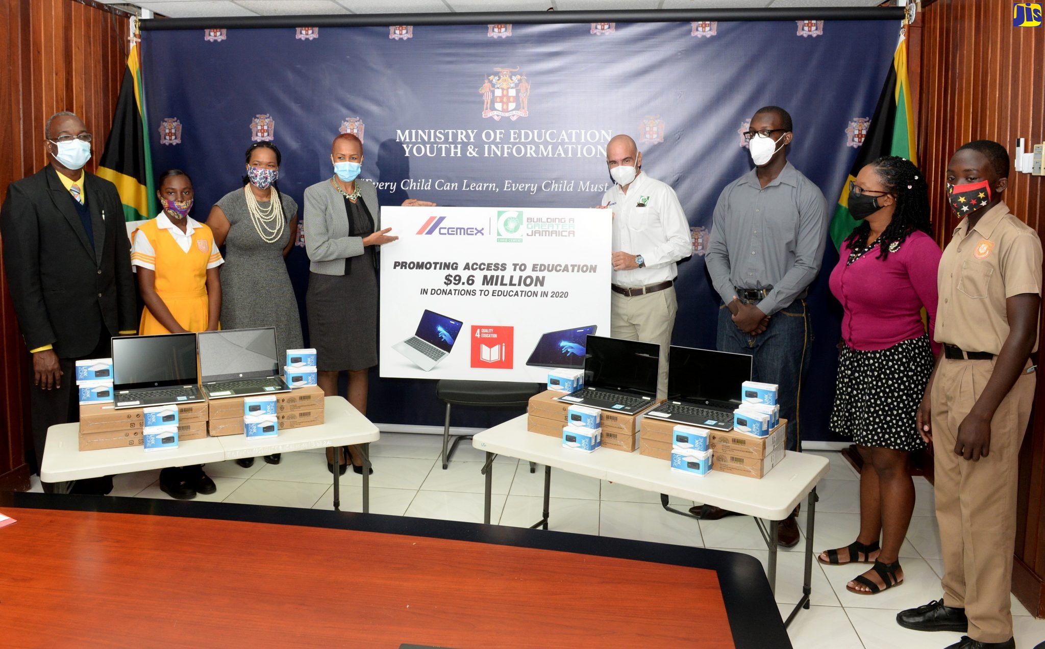 Education, Youth and Information Minister, Hon. Fayval Williams (4th left) with (from left): Principal of the Donald Quarrie High School, Talbert Weir; student Ceandra O’Connor; Acting Chief Education Officer in the Ministry of Education, Youth and Information, Dr. Kassan Troupe; General Manager, Carib Cement Limited, Yago Castro; University of the West Indies (UWI) Mona students, Kyle Service and Shanna-Lee Clarke and Donald Quarrie High student, Gavin Millwood. The occasion was the symbolic handover of vouchers for technology and general school supplies, valued at $5.1 million, that were donated by Carib Cement Company Limited. The ceremony was held at the Ministry’s offices in Kingston on Friday (February 5).