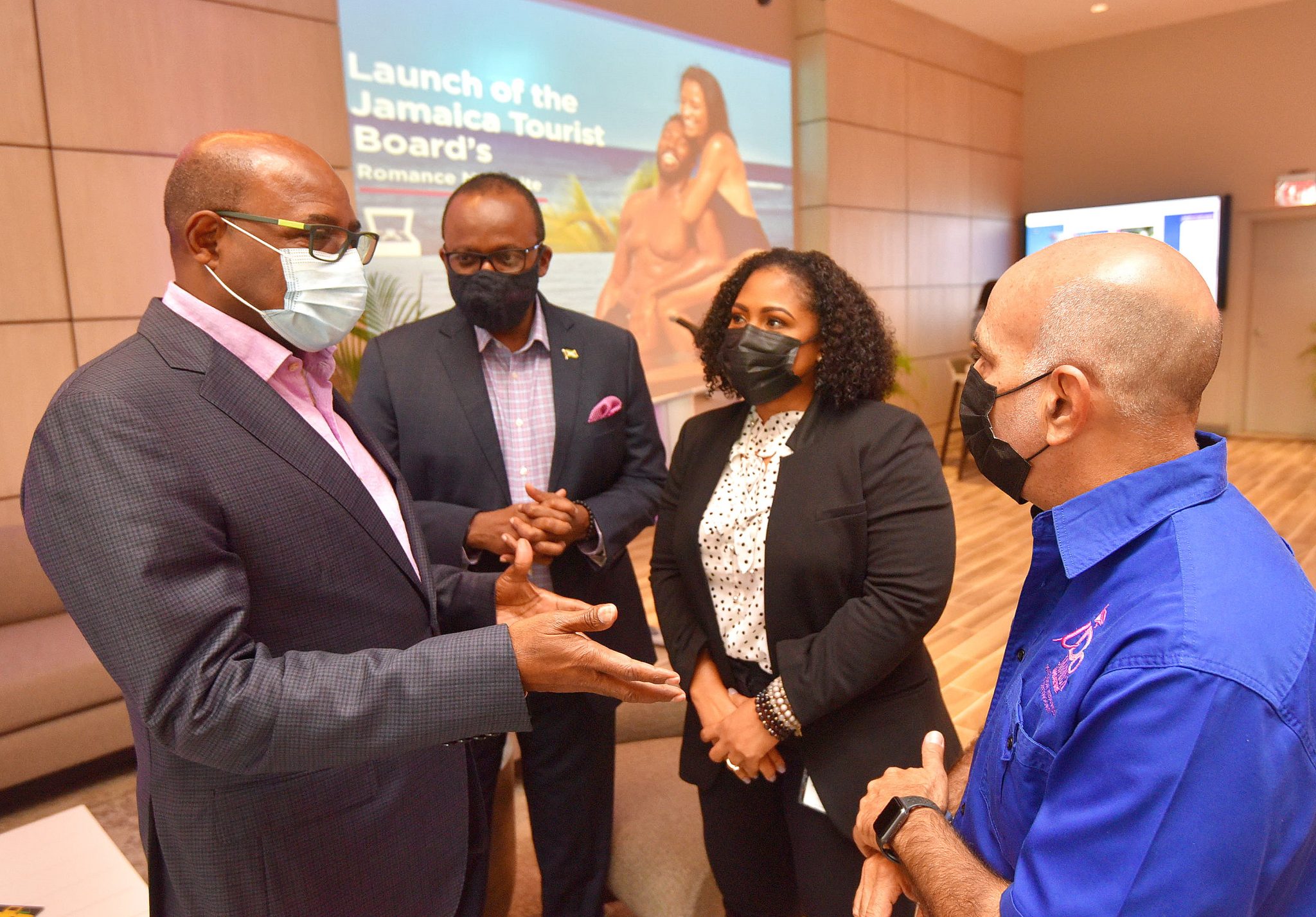 Minister of Tourism, Hon. Edmund Bartlett (left), makes a point to Destination Wedding Consultant and Planner, Peter Shoucair (right), during the launch of the Jamaica Tourist Board’s (JTB) romance microsite, dubbed ‘My Heartbeats JA’, at the AC Hotel by Marriot in St. Andrew on February 4. Listening from (second left) are Director of Tourism, JTB, Donovan White and Deputy Director of Tourism and Marketing, Camile Glenister. My Heartbeats JA can be accessed on the Visit Jamaica platform located at www.visitjamaica.com

